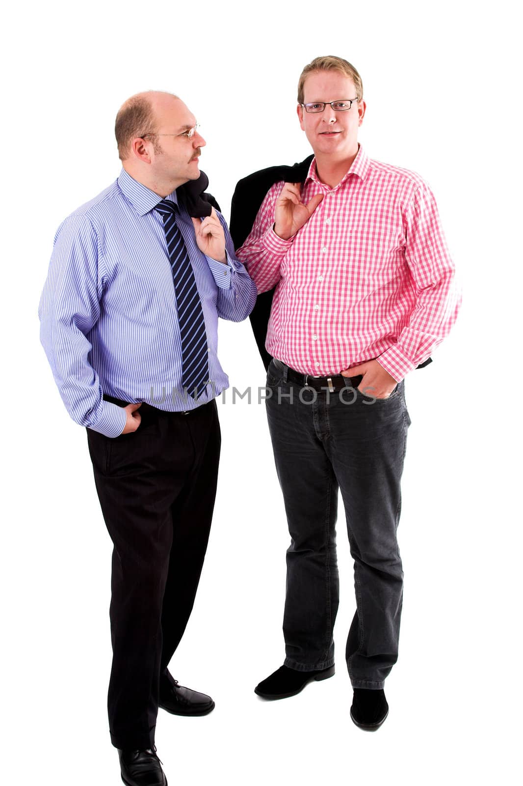 Two businessman standing on white background with their coats casually over their shoulder