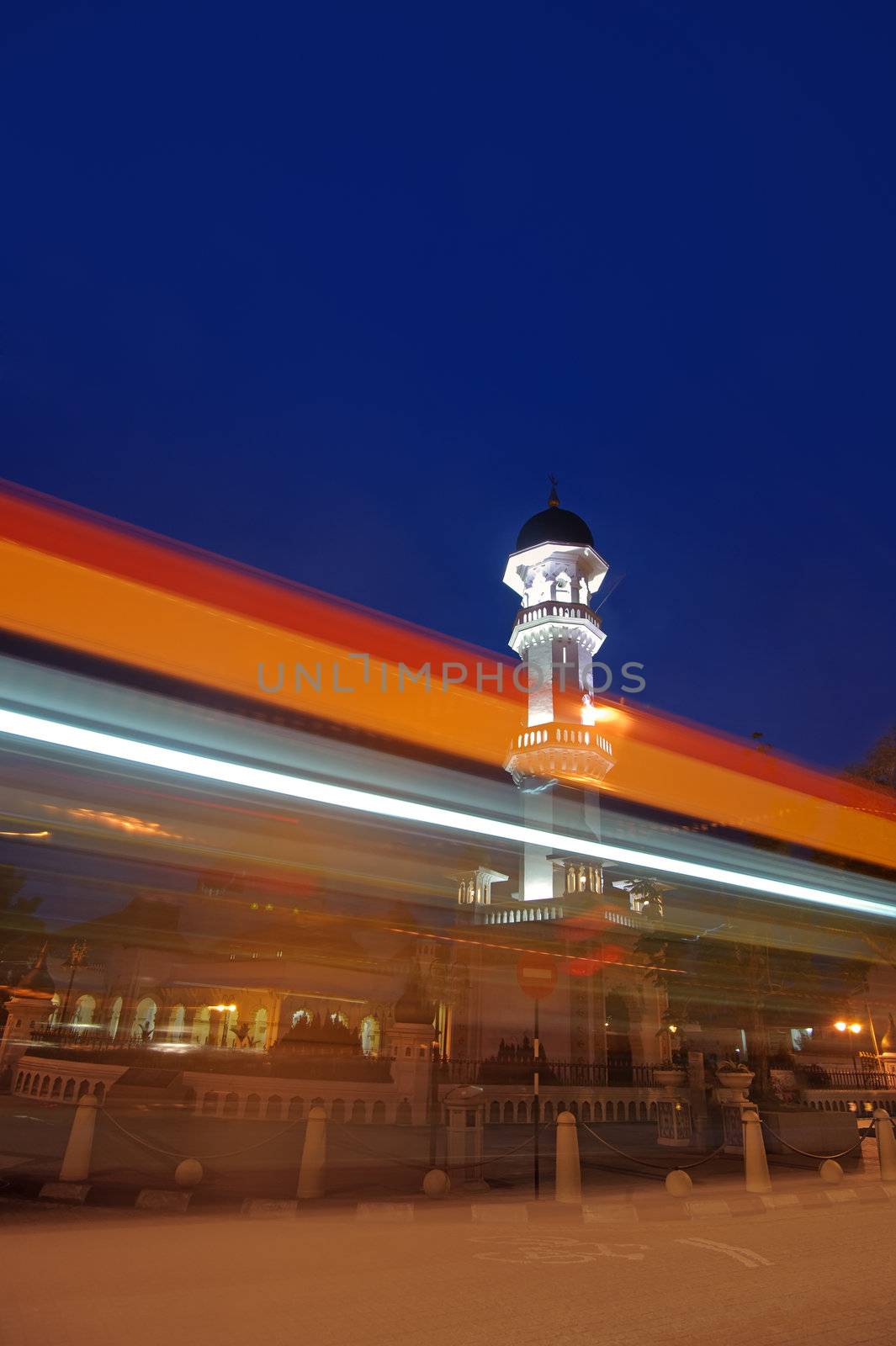 Colorful city night with famous landmark and fast moving car lighting, Malaysia, Asia.