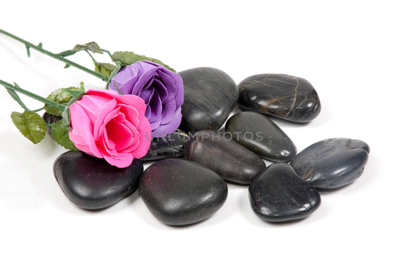 little stones with roses on top of it
