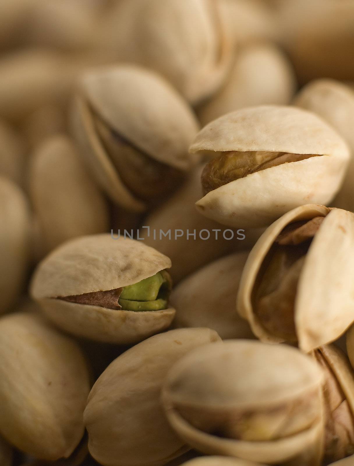 multiple pistachios background, warm brown color, distance blur