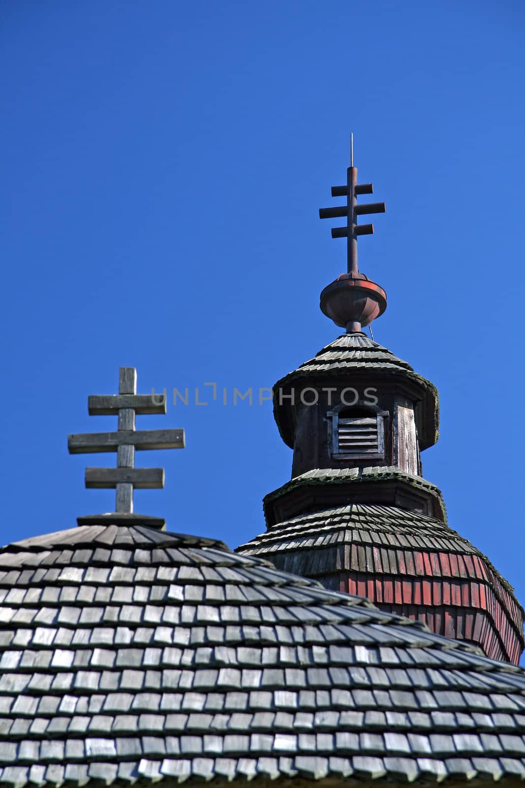 detail photo of an old wooden orthodox church with typical crosses, 