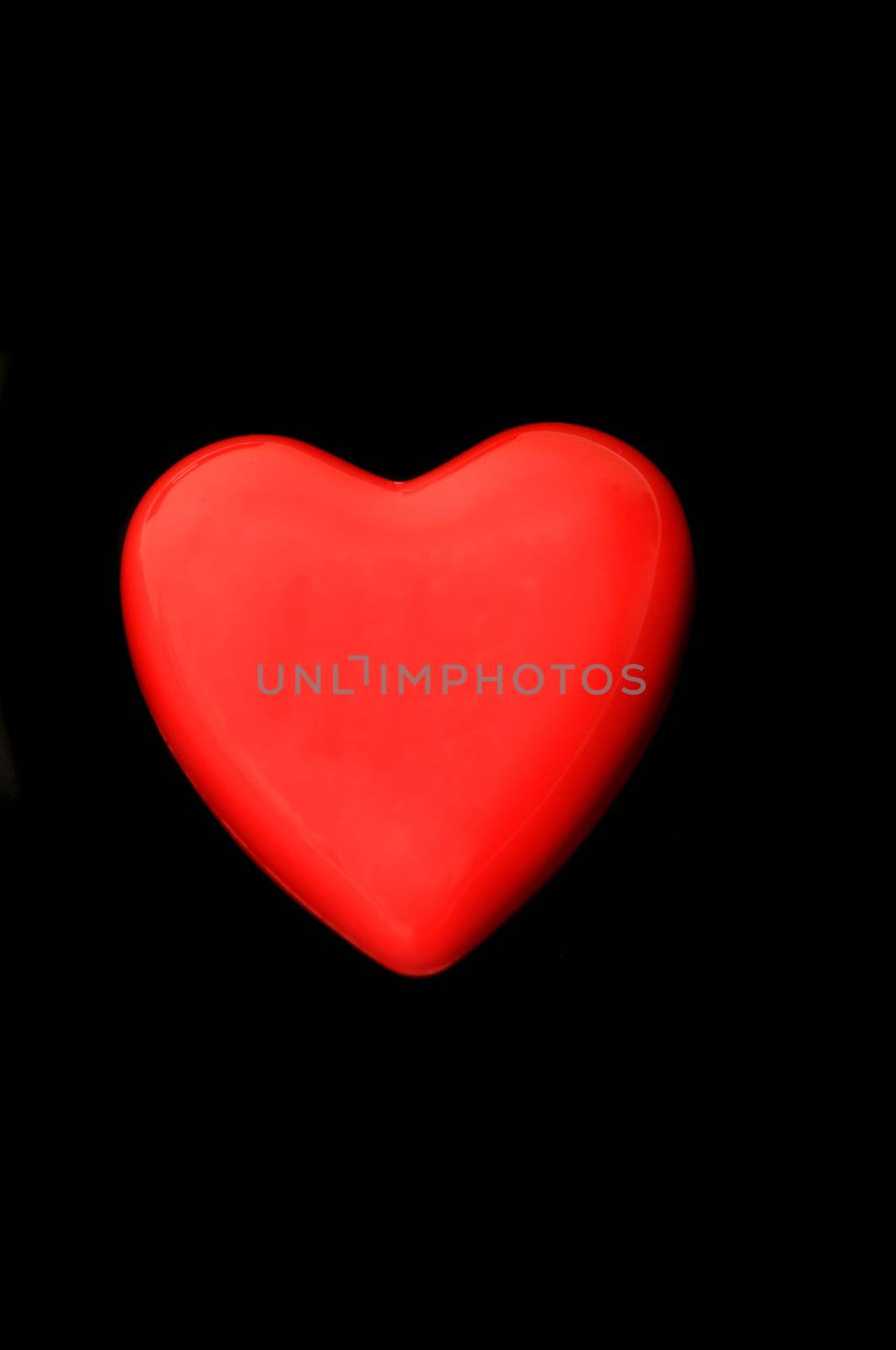 Red heart isolated on a dark back ground