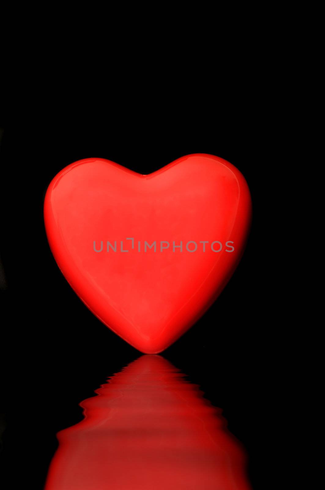 Red heart isolated on a dark back ground