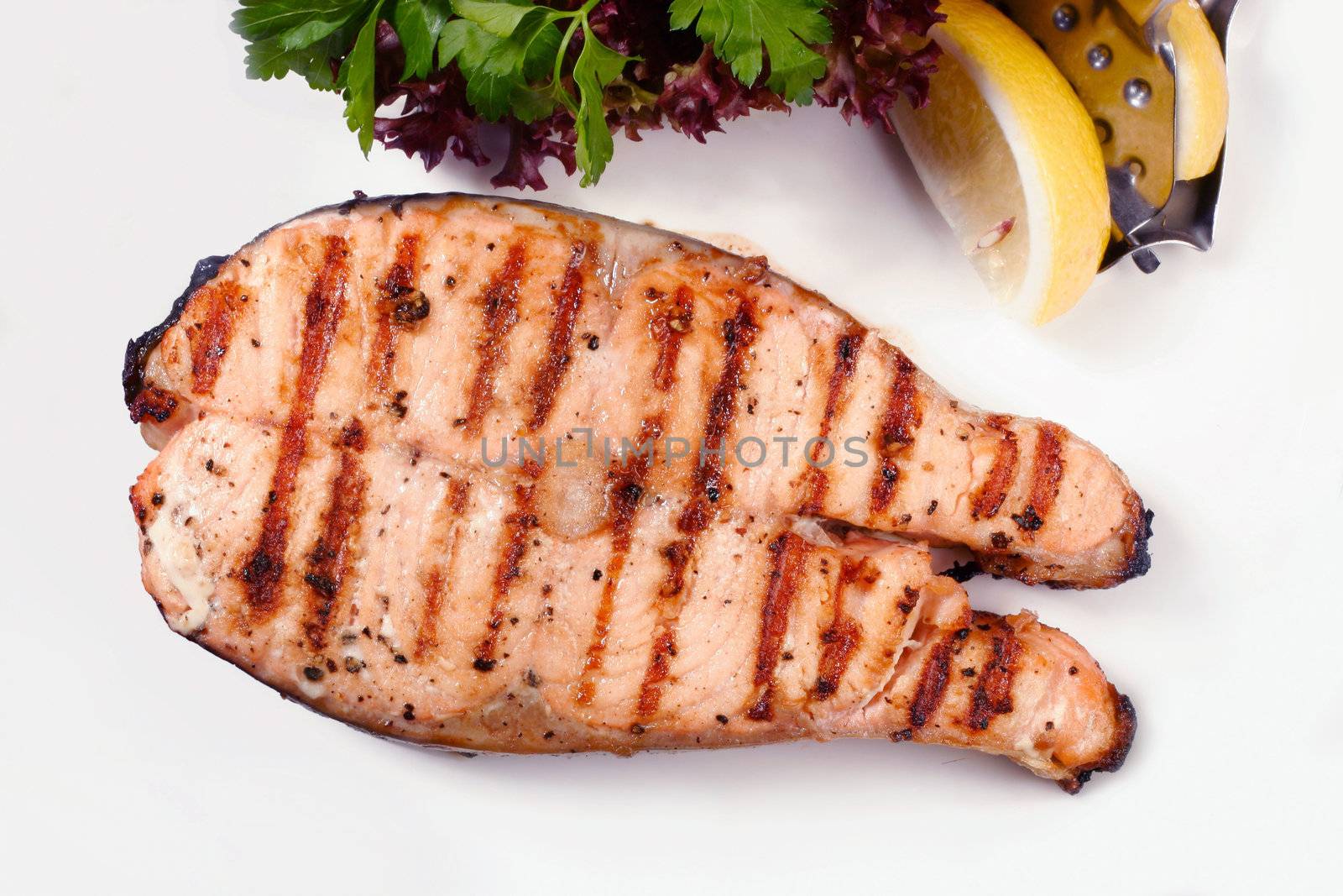 Grilled salmon steak with salad and lemon by igor_stramyk