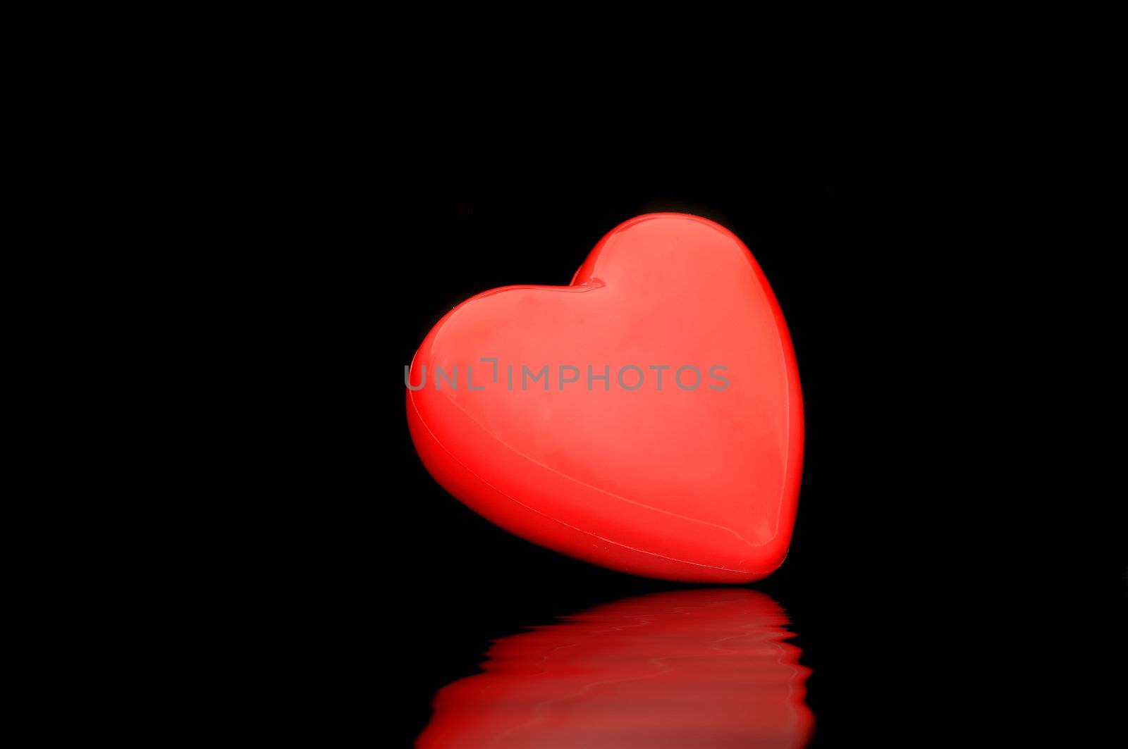 Red heart isolated on a dark back ground