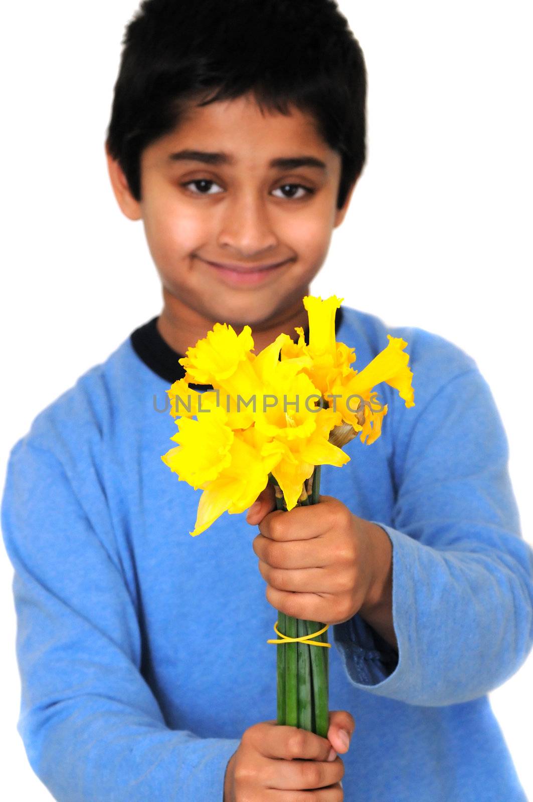 An handsome kid handing a boquet of daffodils