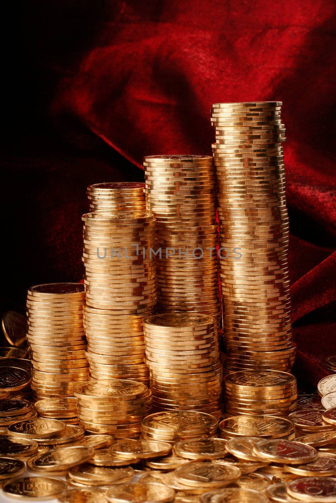 Golden coins on red background