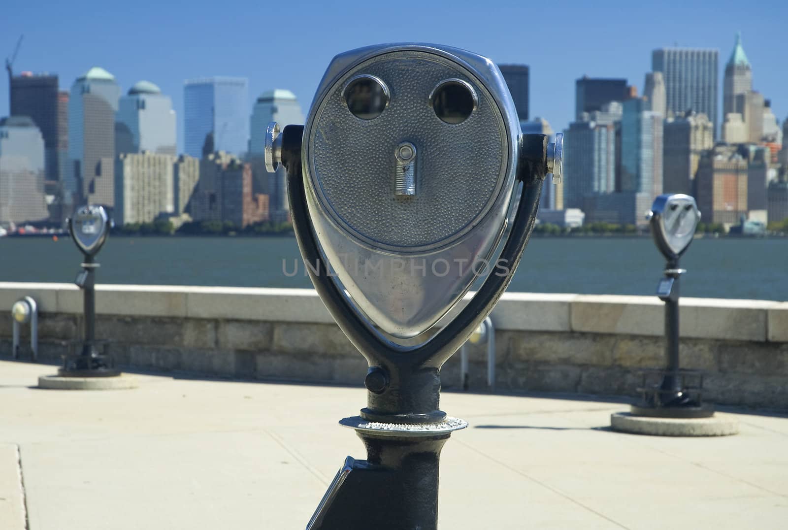 binoculars at jersey city, new yorks manhattan in distance