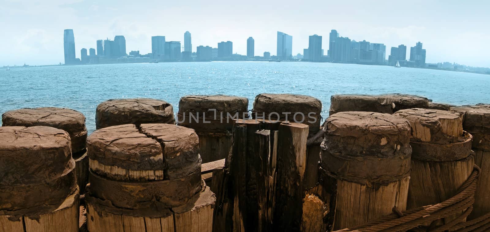 Jersey City viewed from Manhattan, wooden pier in foreground