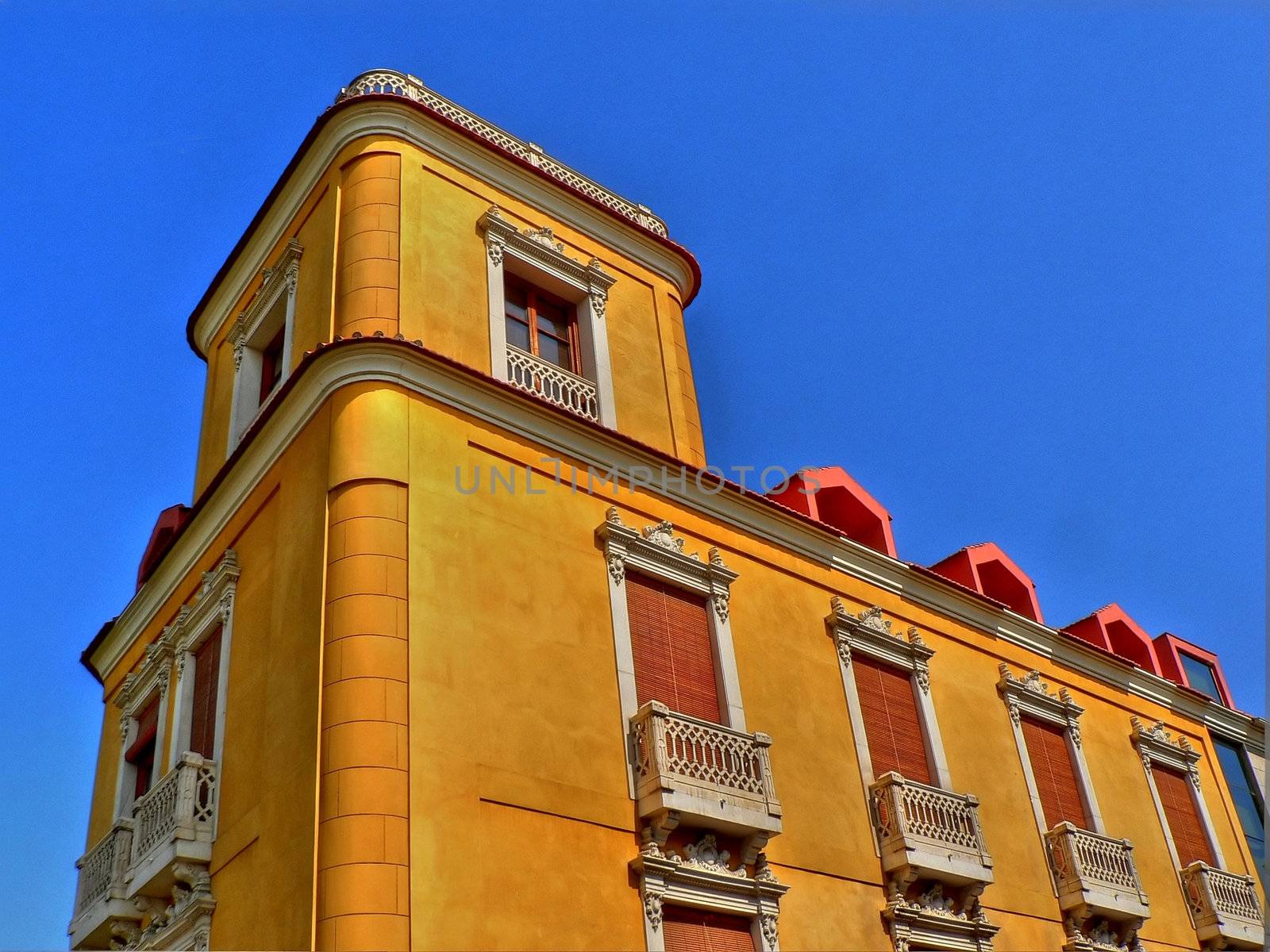 Yellow buiding in the city of Murcia in Spain