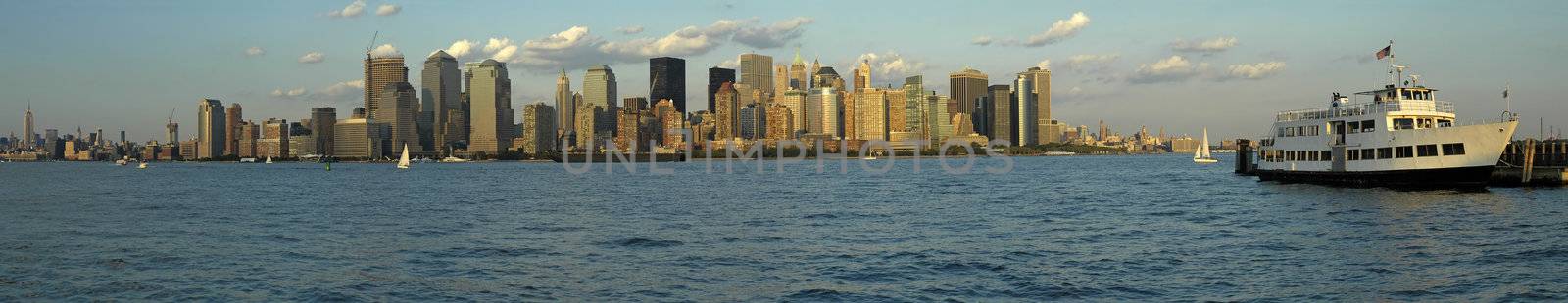 Manhattan panorama photo, white passenger boat in foreground, photograph taken from New Jersey