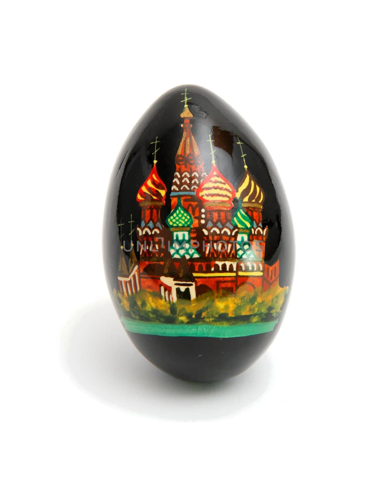 Russian Easter egg painted black with Saint Basil's cathedral on white background