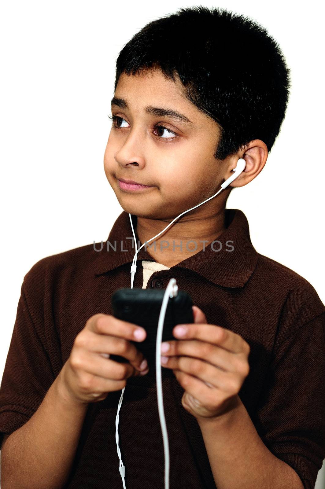 An handsome Indian kid listening to music happily