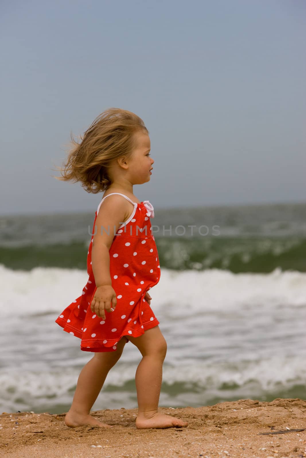 people series: little girl are run on the beach