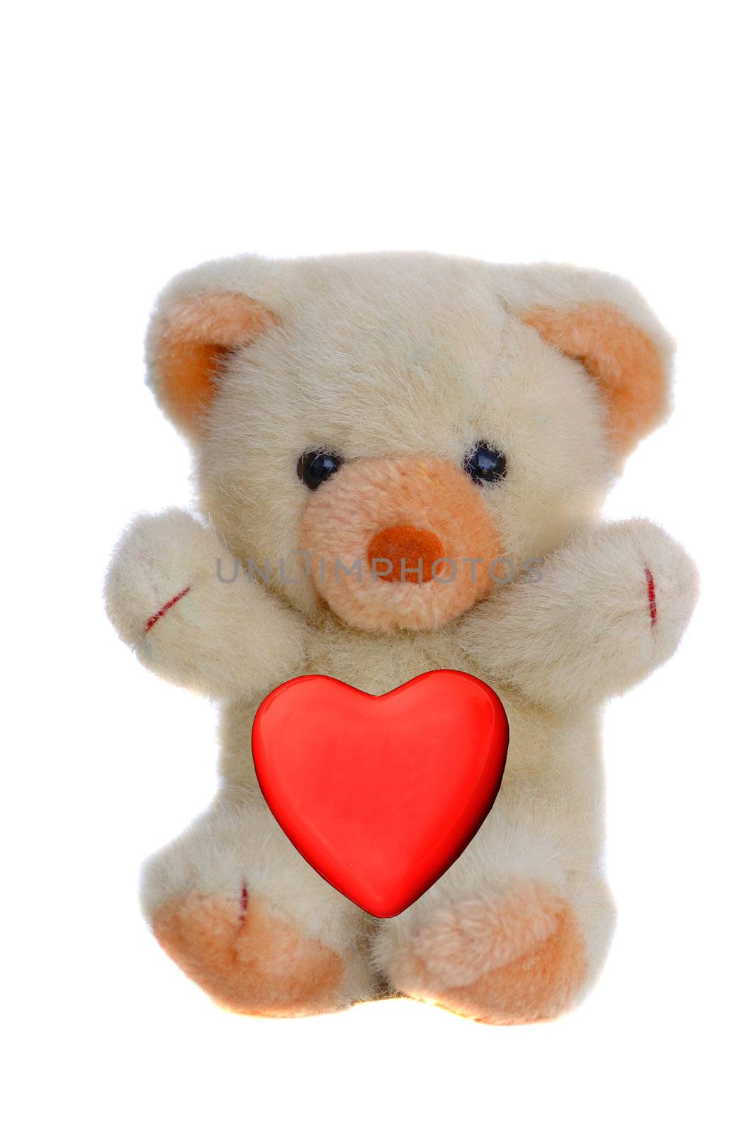 A beautiful teddy bear with red heart a symbol of peace and love 