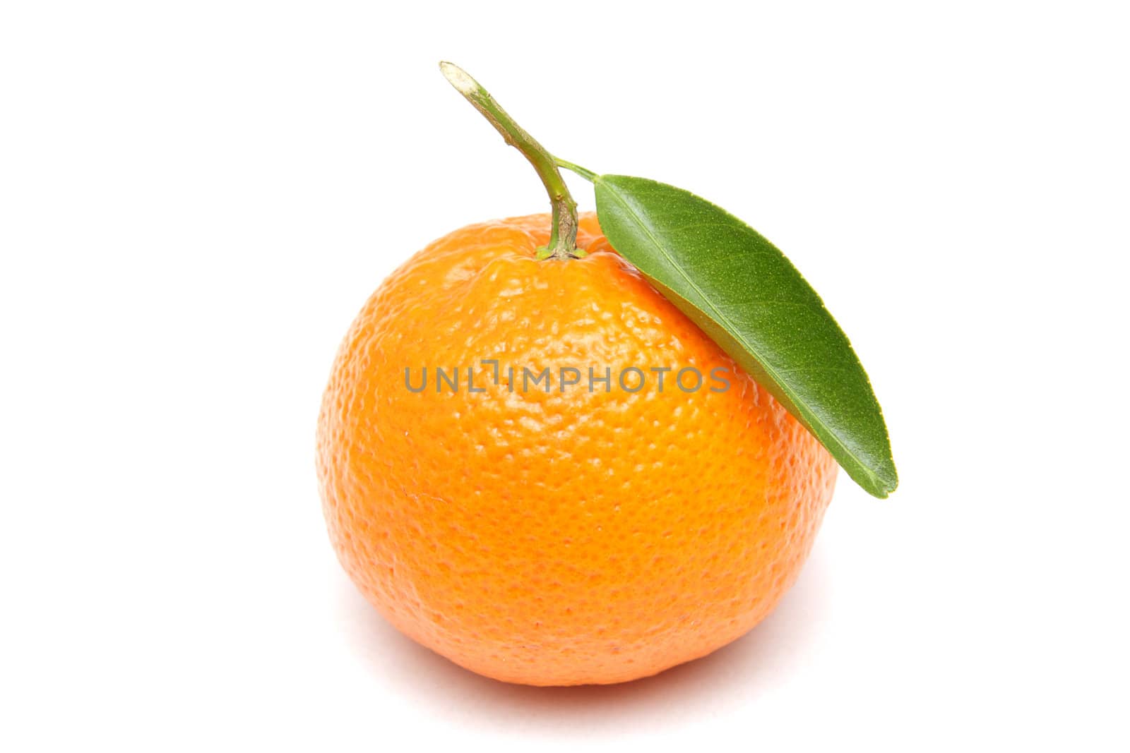 Ripe mandarin with green leaf isolated on white background