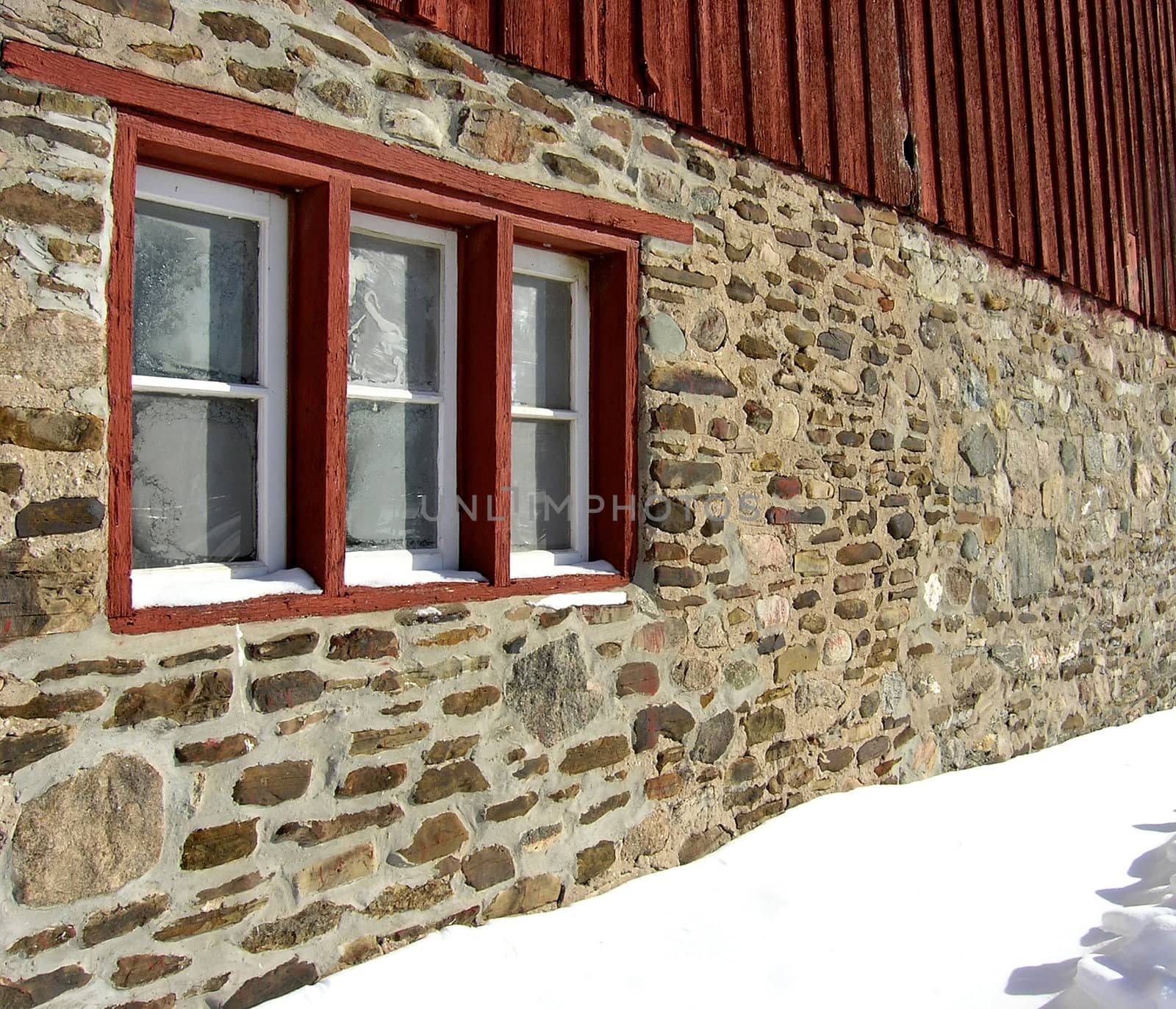 In a very cold day the windows of the building are covered by ice. 