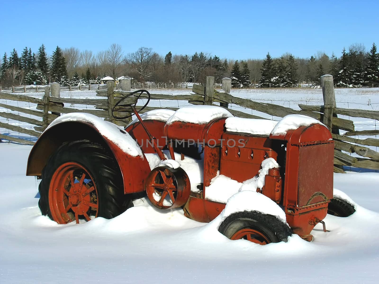 Old model agriculture machinery not longer in use during winter time. 
