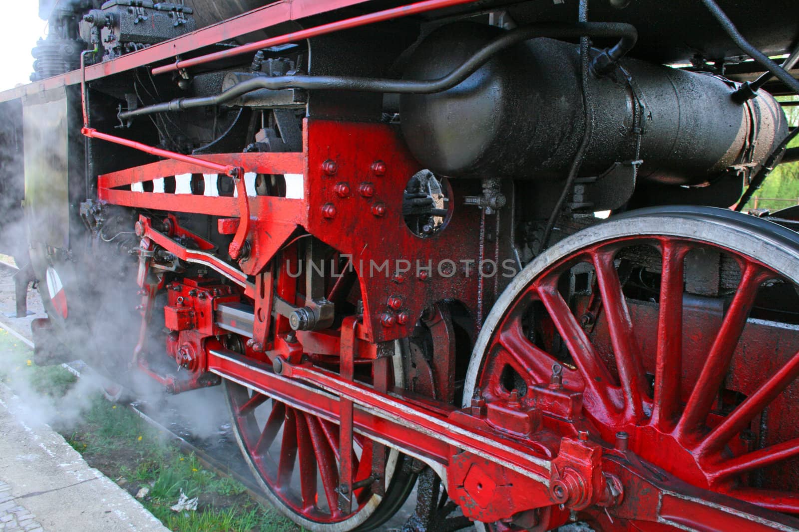 Closeup of steam locomotive wheels with suspension