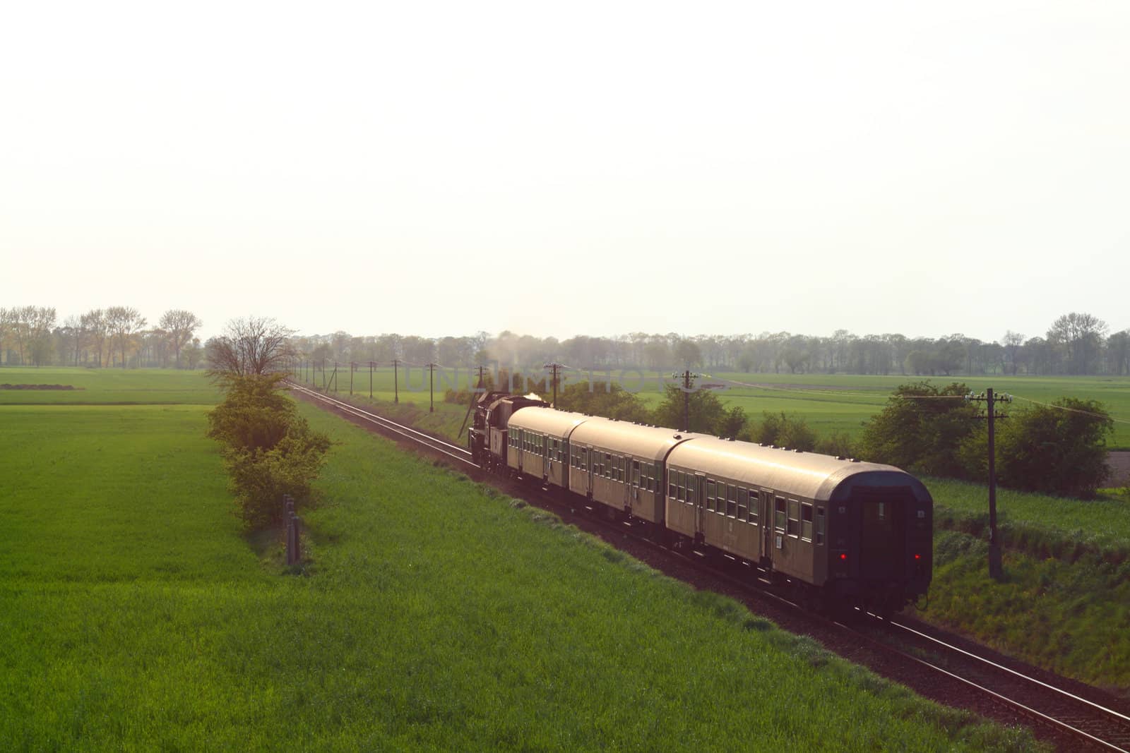 Steam retro train passing the countryside