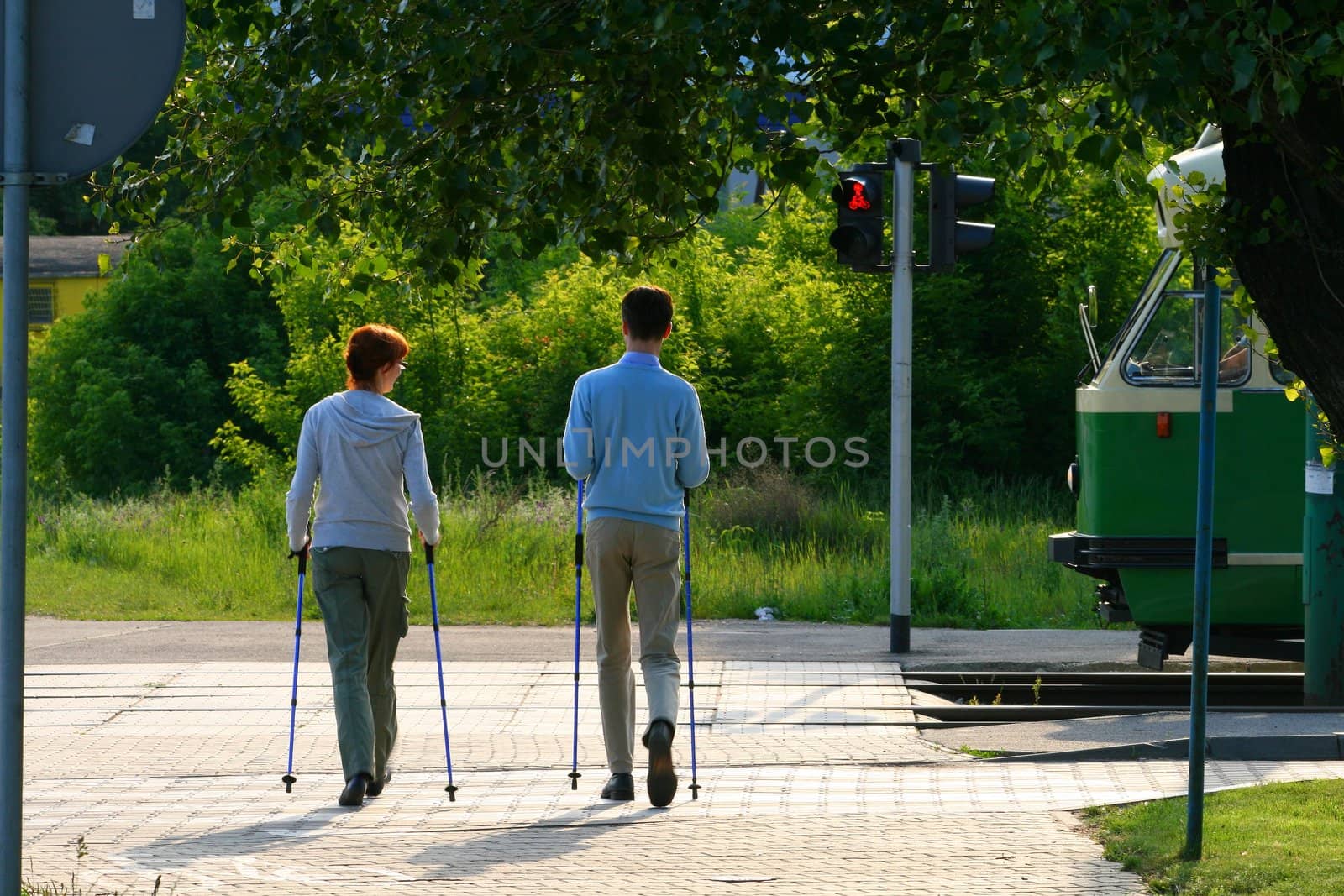 Happy couple doing nordic walk