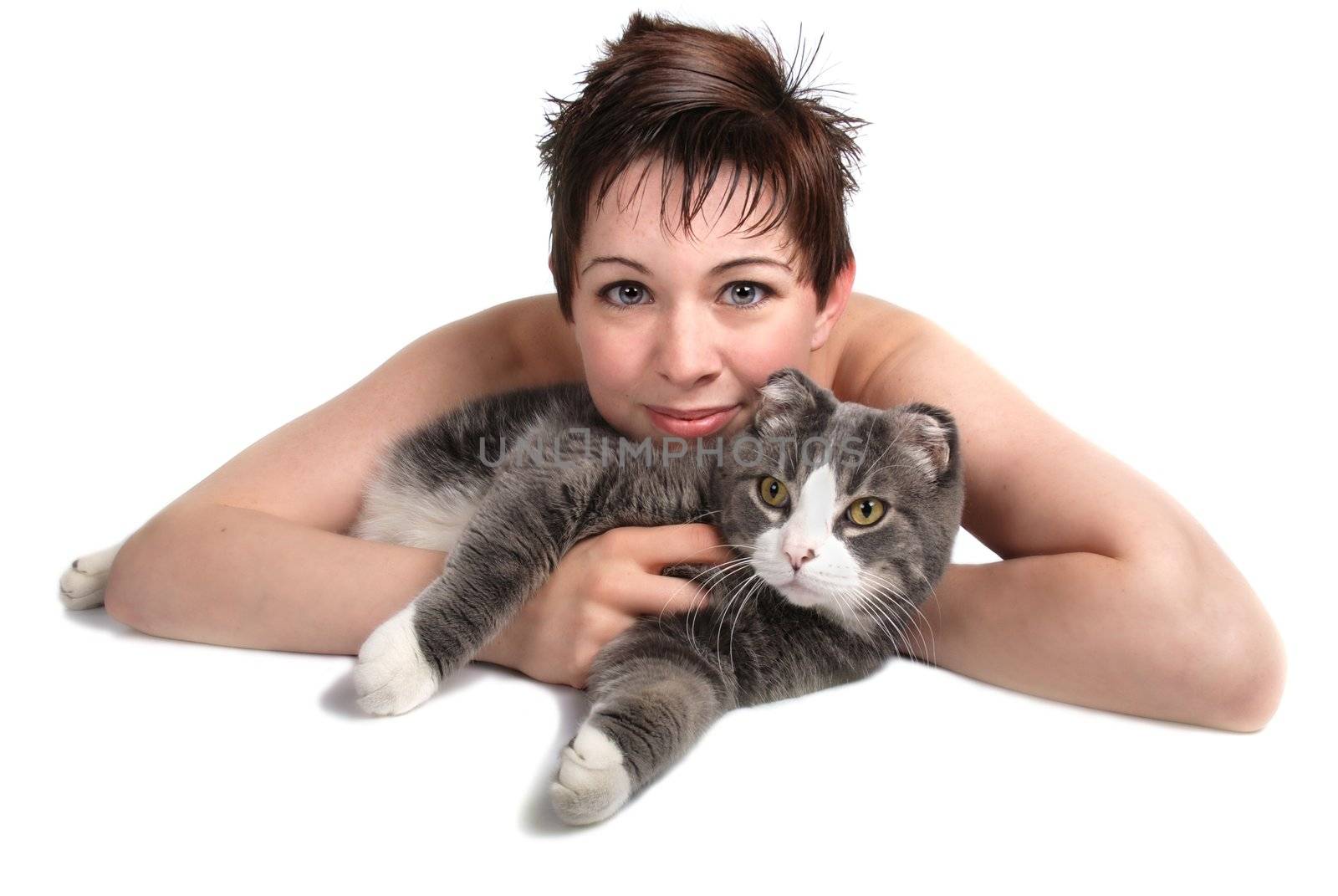 Pretty girl laying down cuddling her pet cat