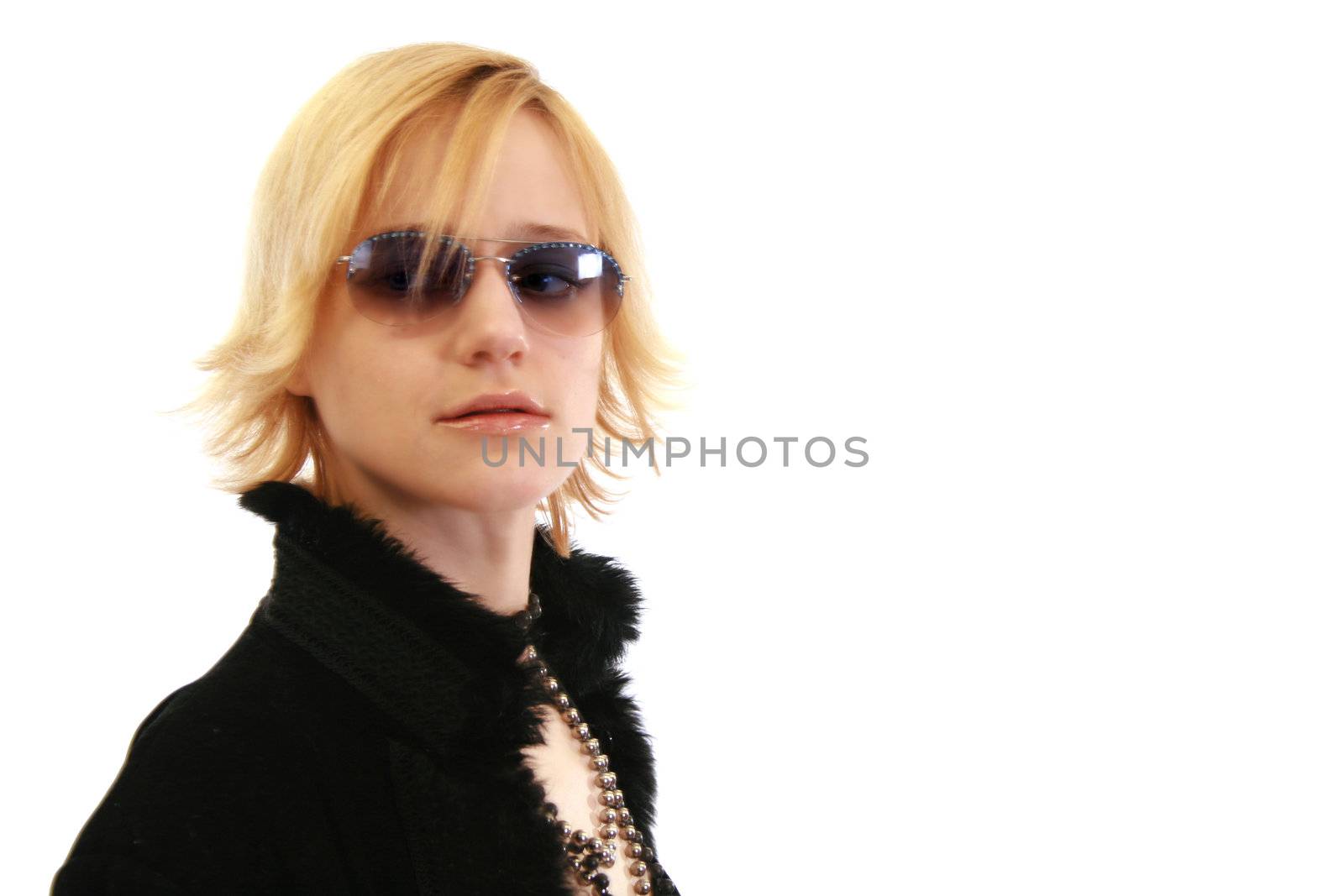 Blonde woman in sunglasses and a furry coat with copy space