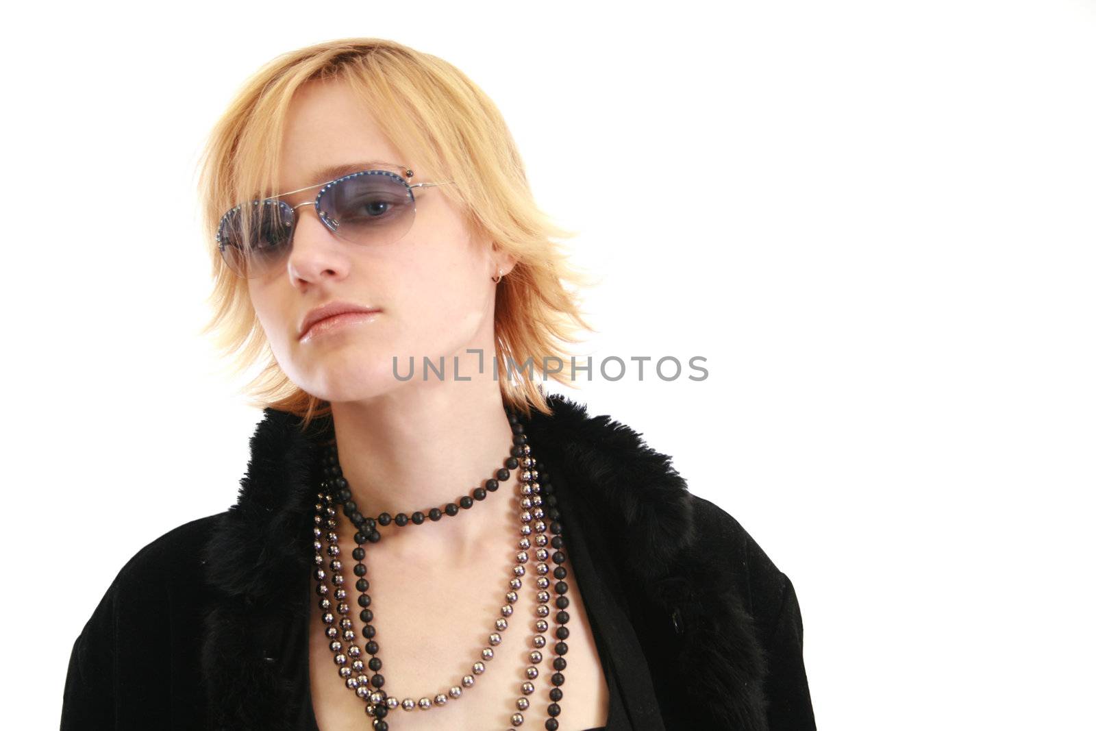 Beautiful blonde woman in sunglasses and a furry coat