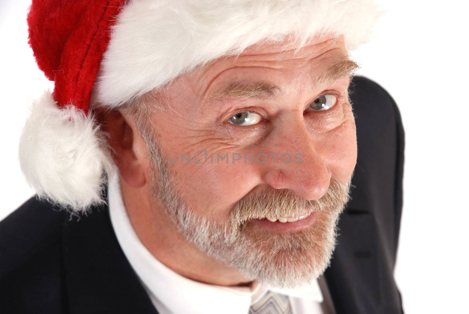 Senior Businessman wearing Santa Claus hat