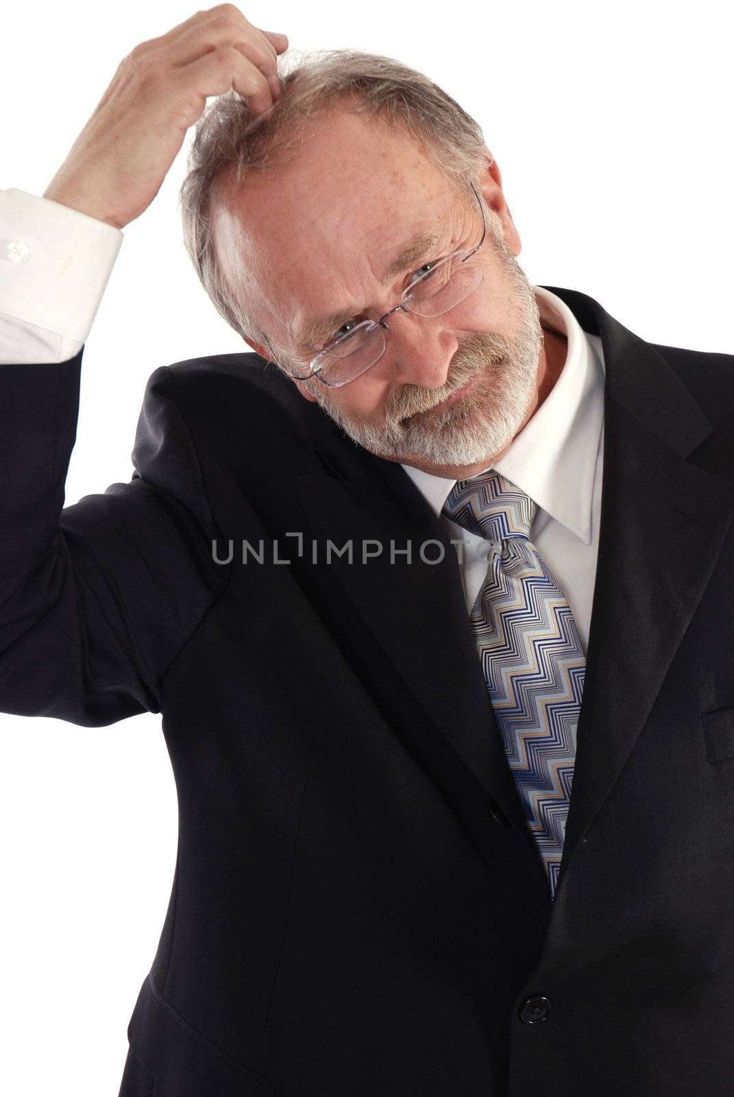 Senior businessman scratching his head 