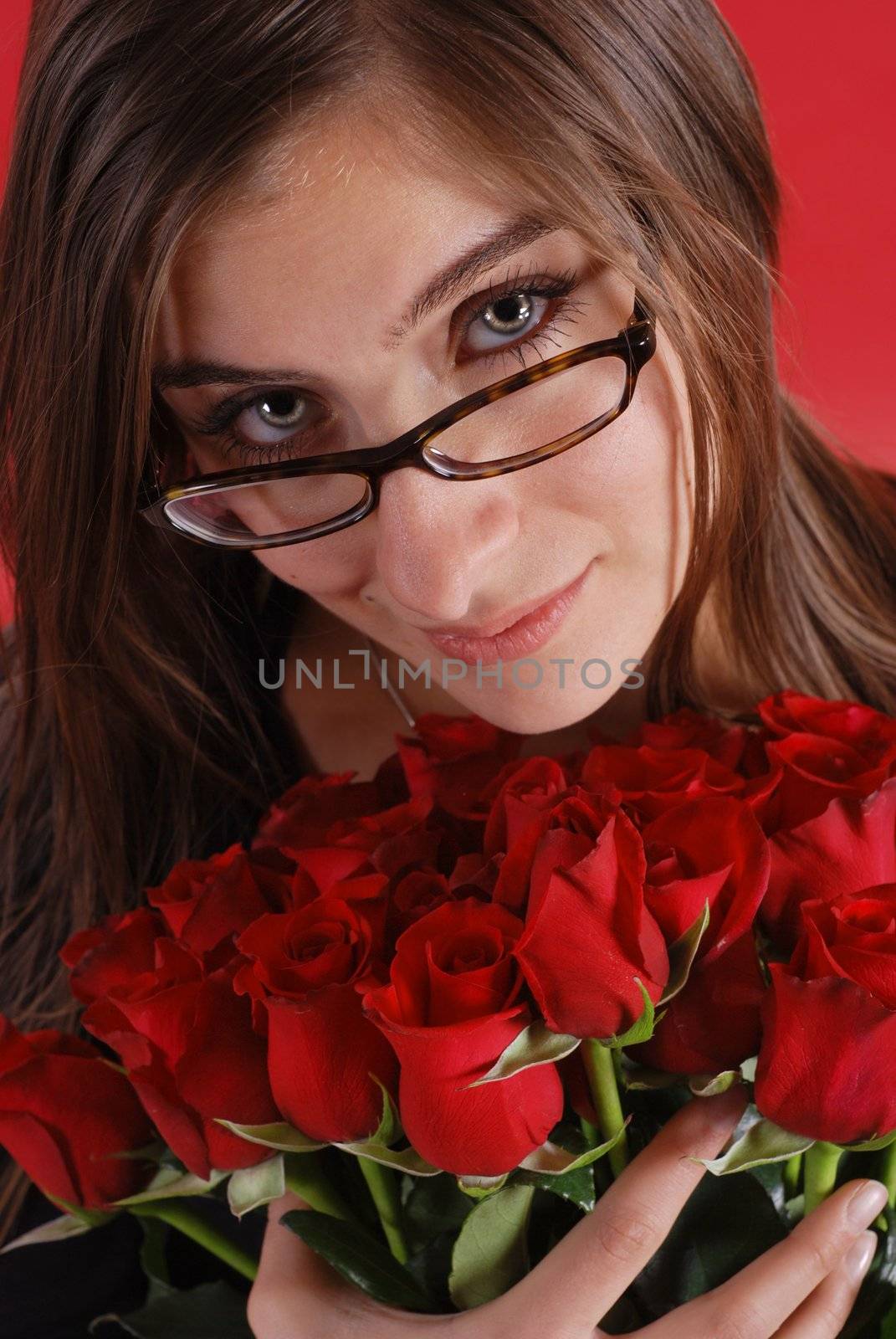 Beautiful woman with bouquet of roses