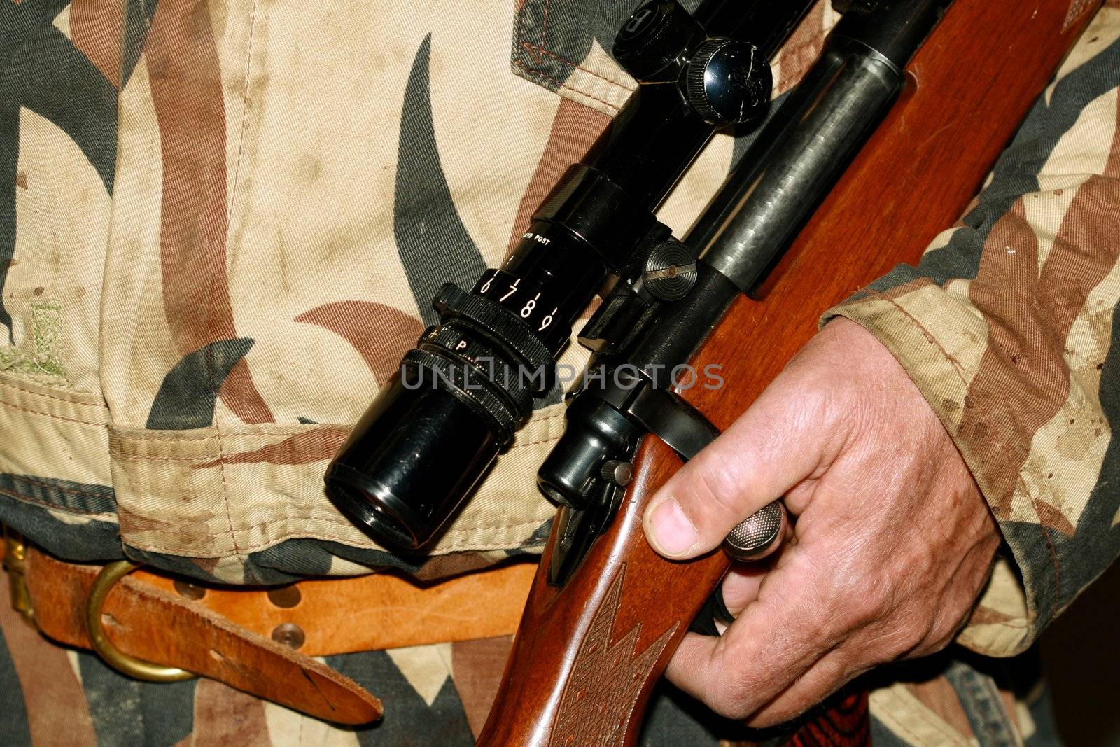A hunter holding his riffle