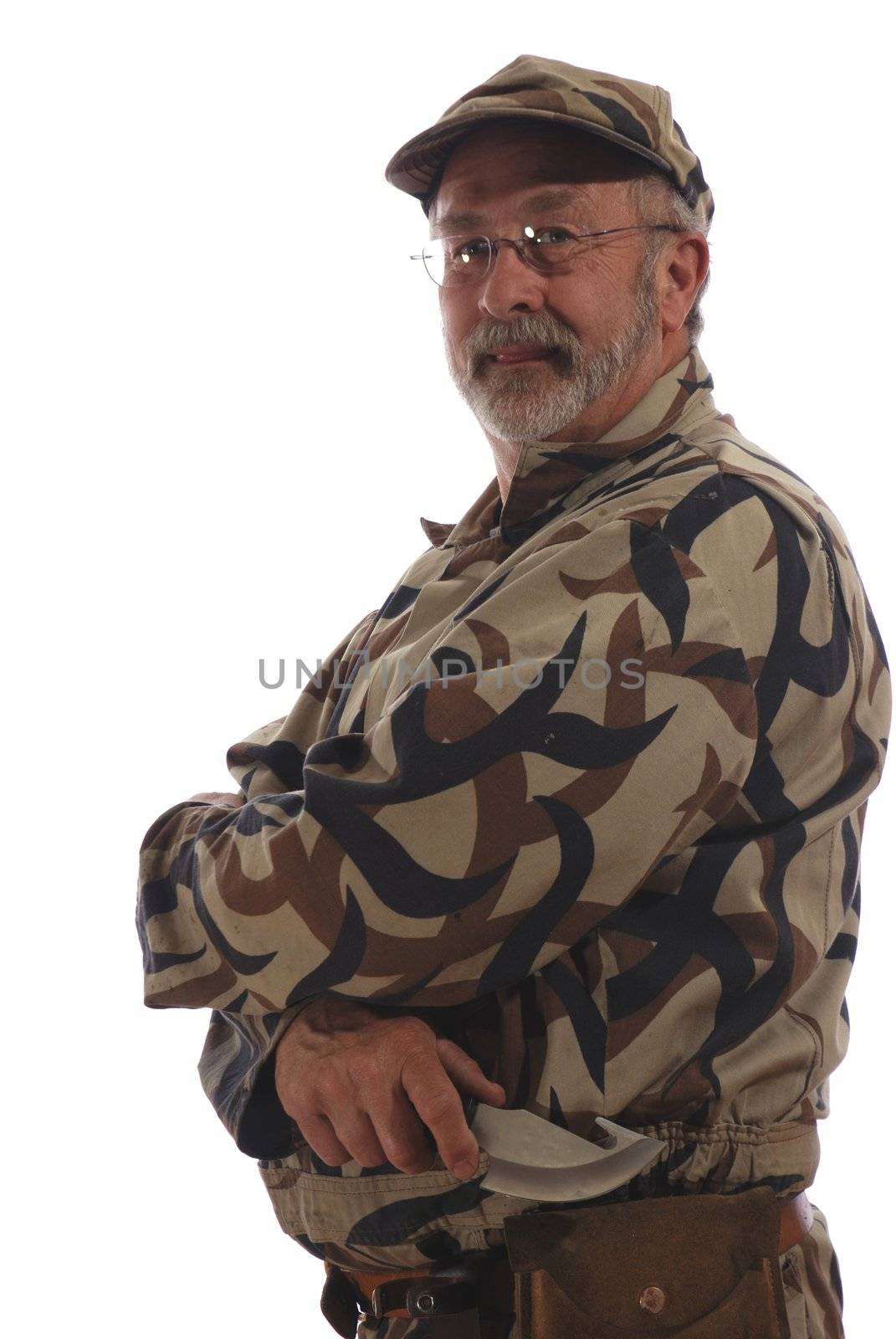 An old hunter holding a knife.