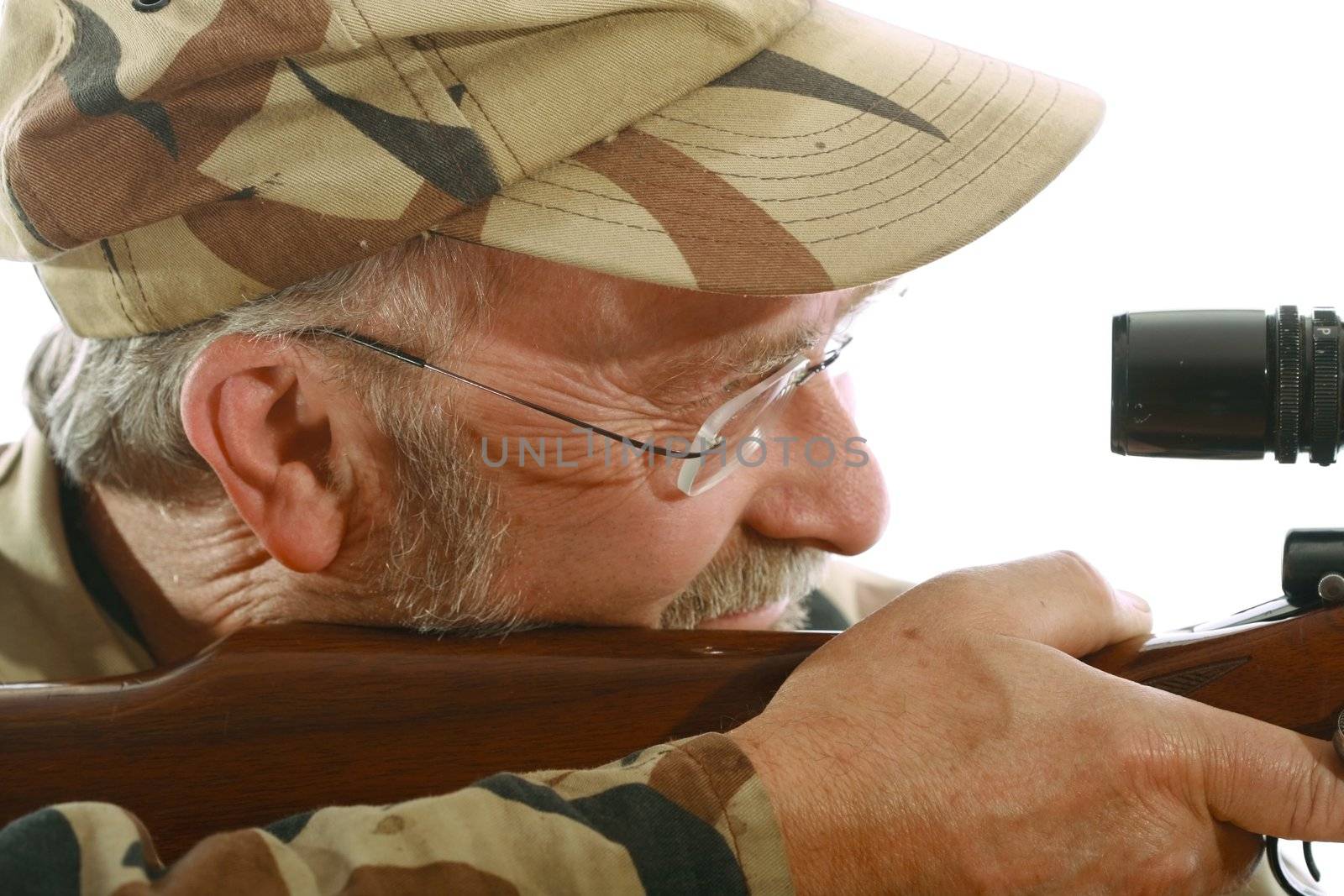 Hunter looking through the scope of his riffle.
