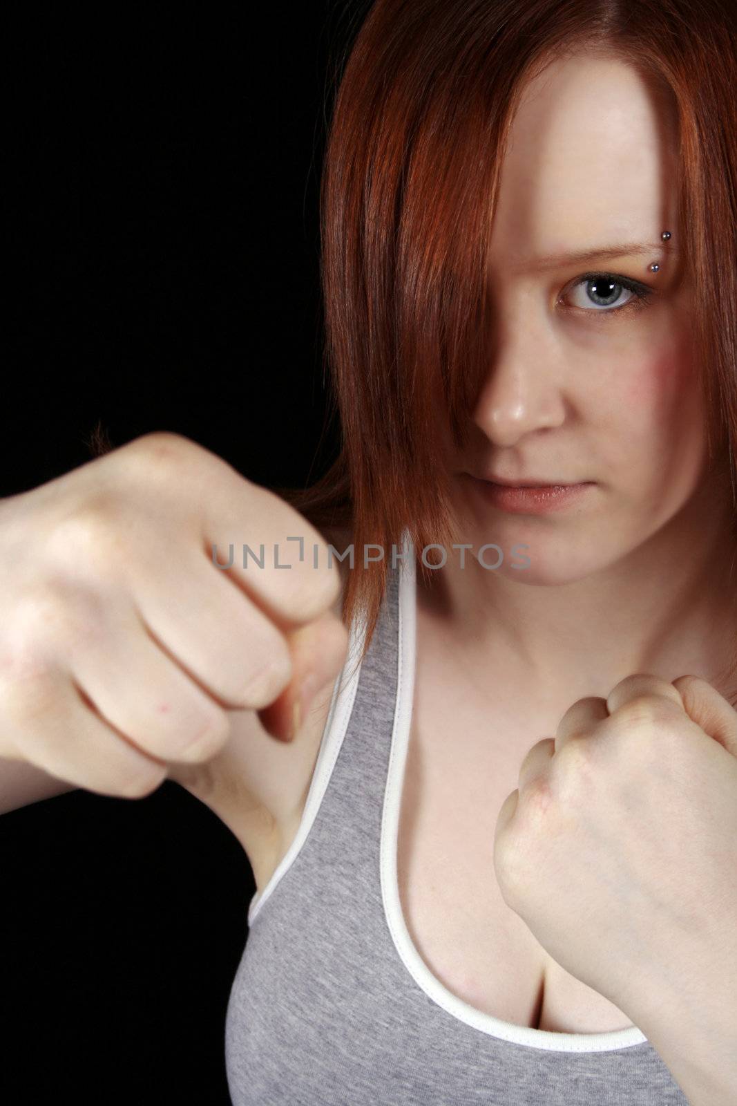 red haired teen girl doing a boxing workout