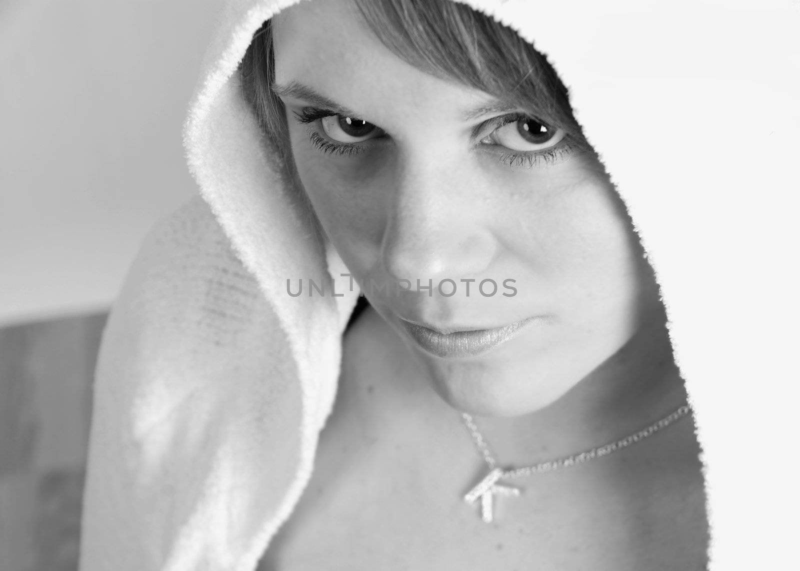 Black and white of a girl in a hoodie. Grunge theme.