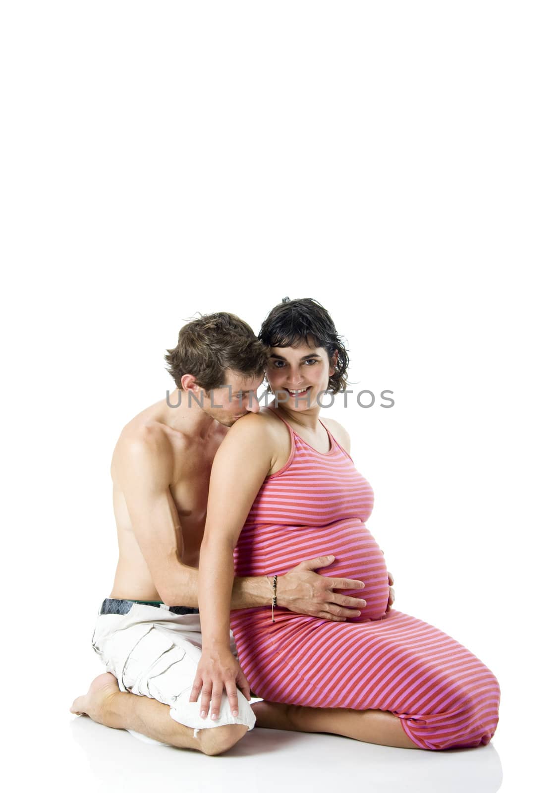 Beautiful couple in love expecting a baby - Isolated on white