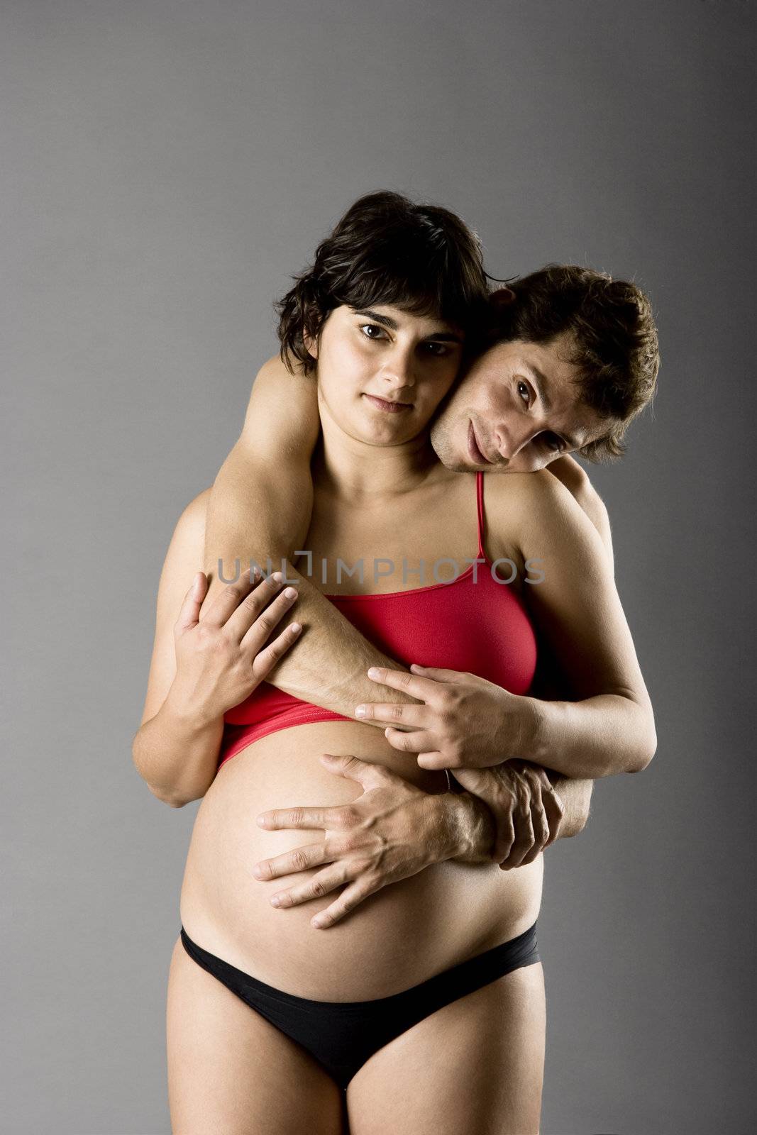 Beautiful happy couple in love expecting a baby 