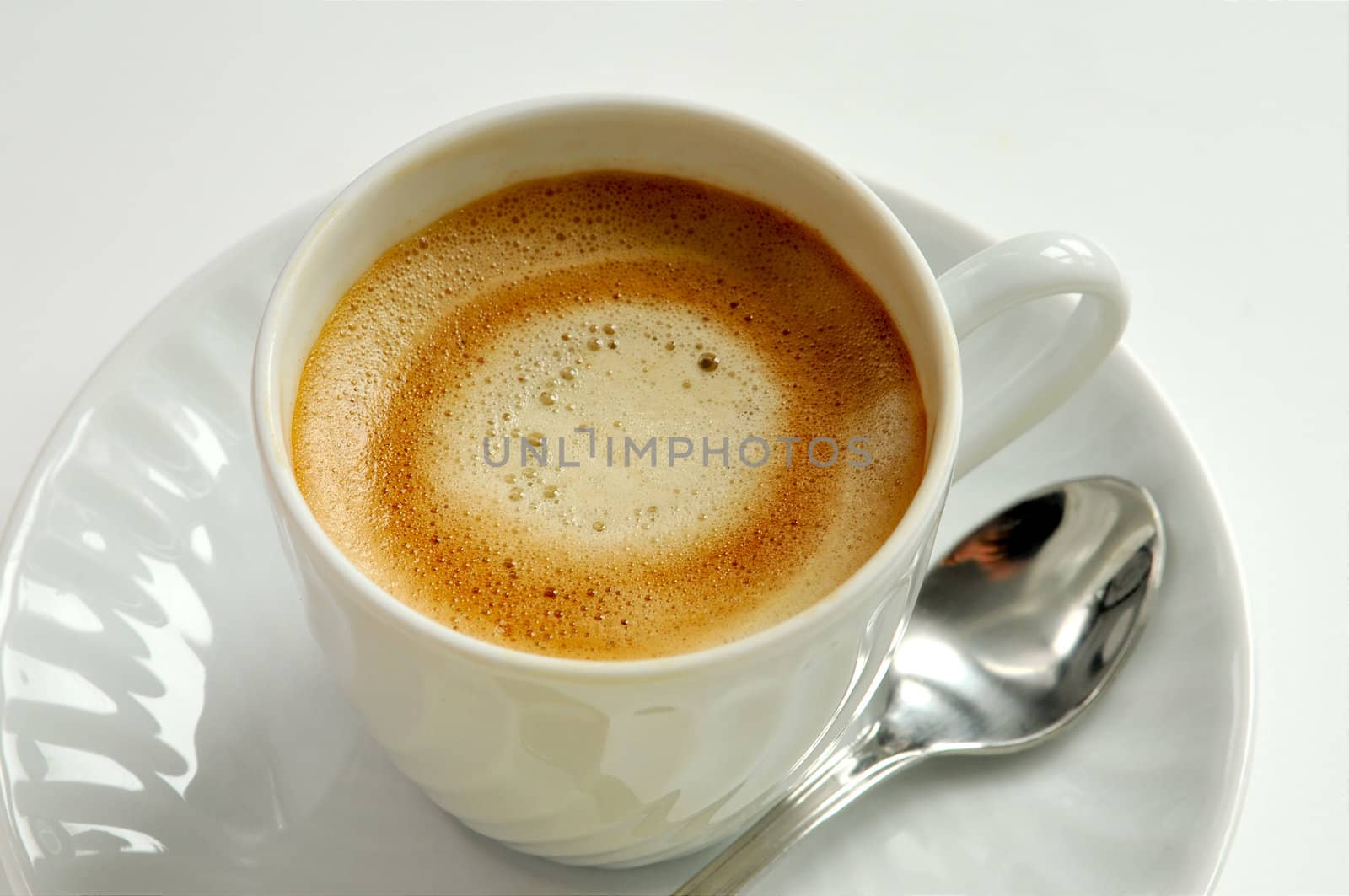 coffee on white cup with spoon