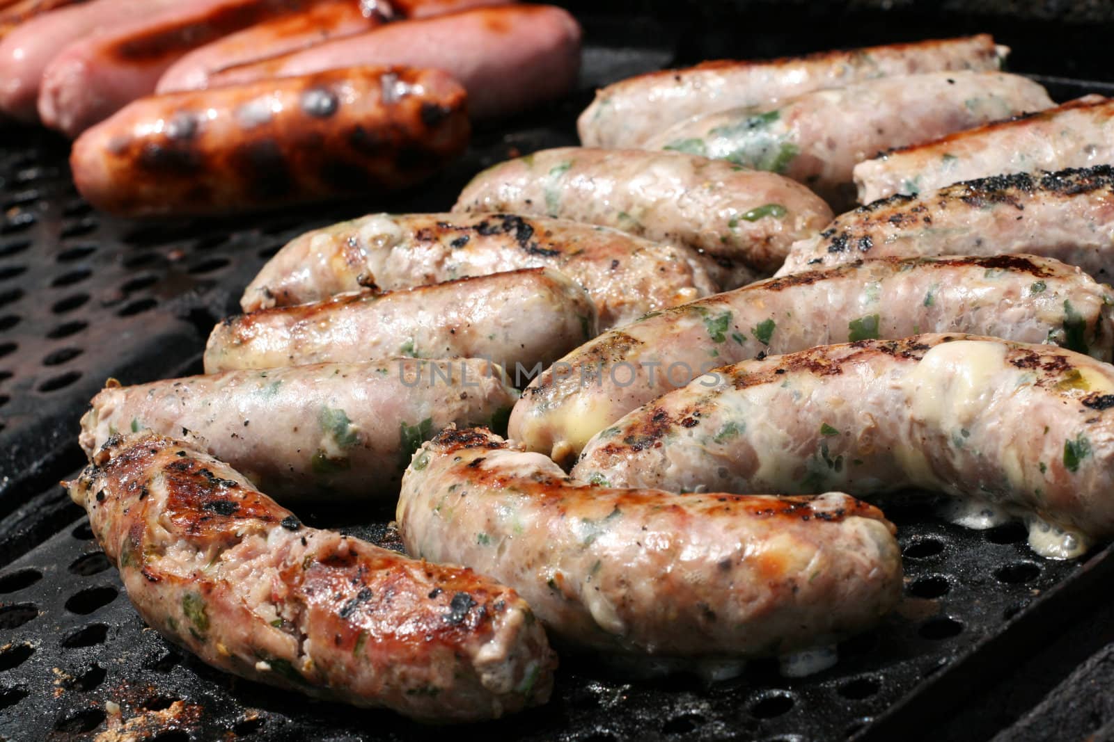 Maltese and pork sausages on a barbecue