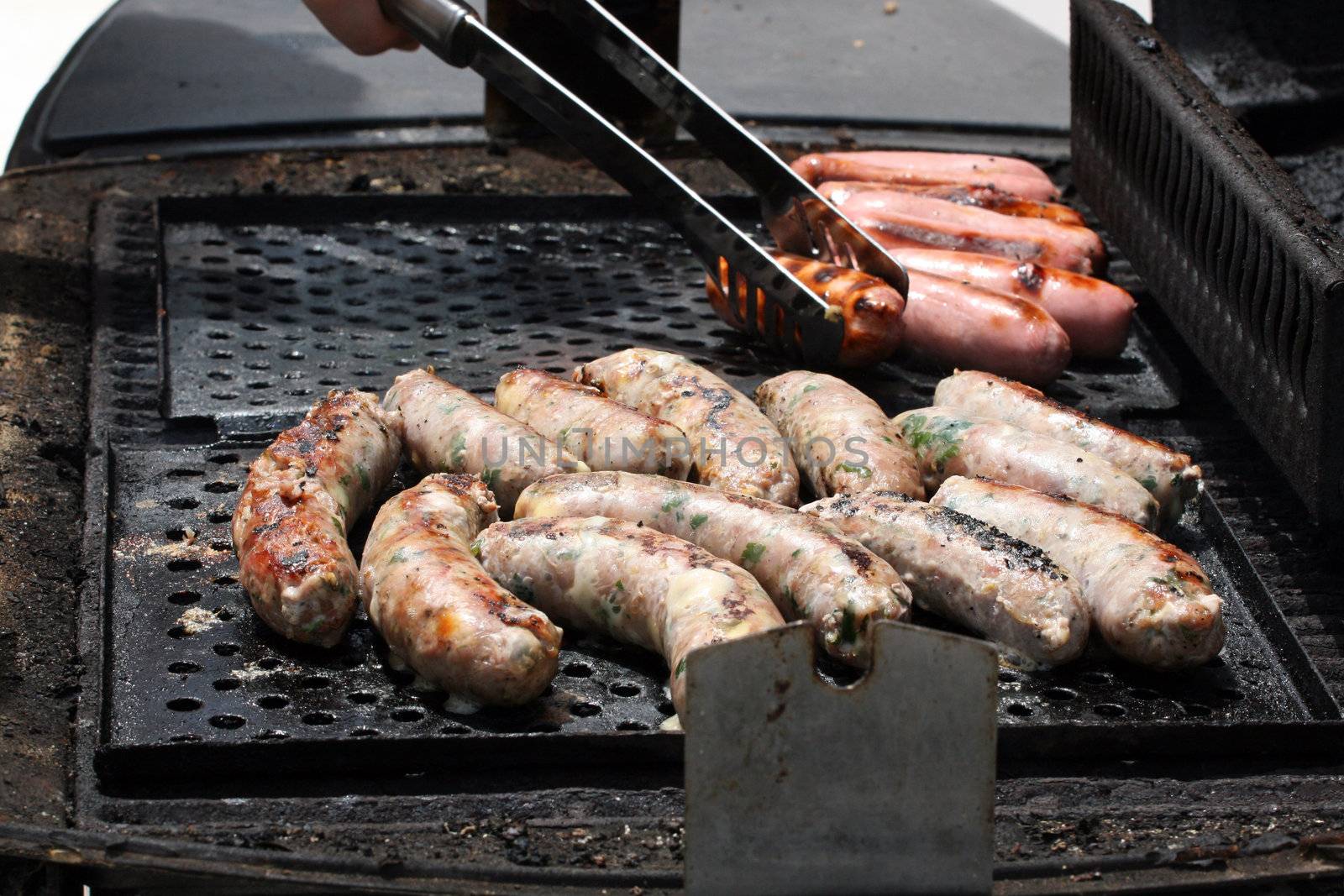 Maltese and Pork sausages on a barbecue