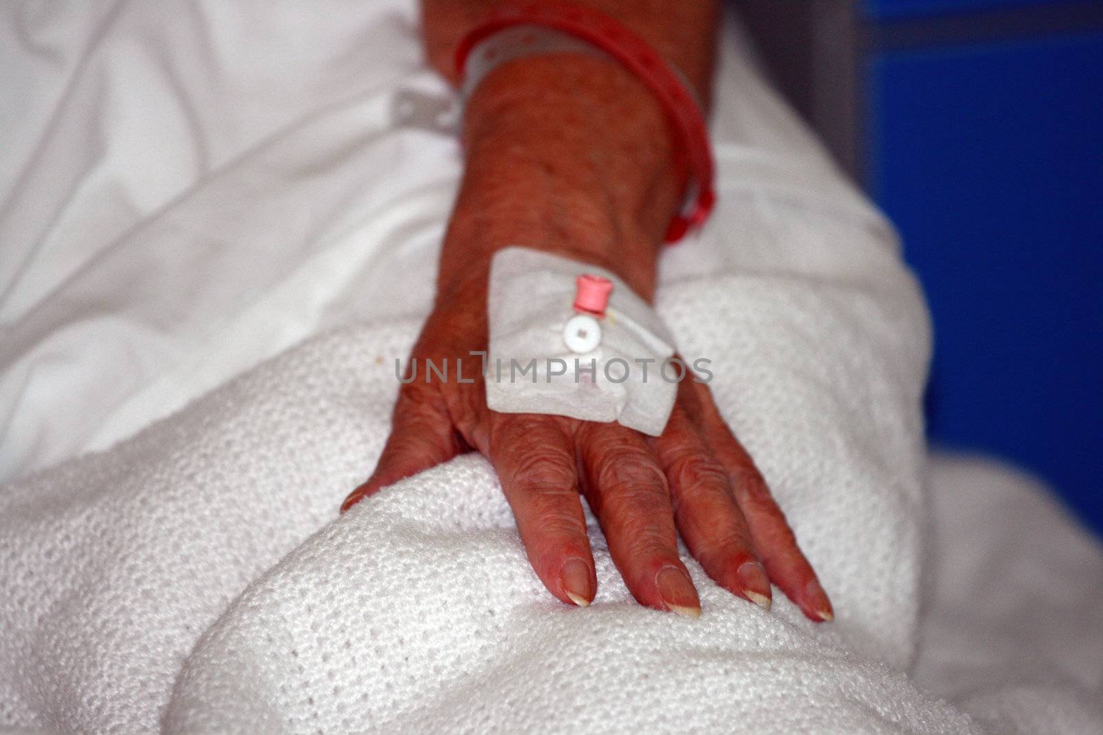 elderly hand prepared for the drip  by keki