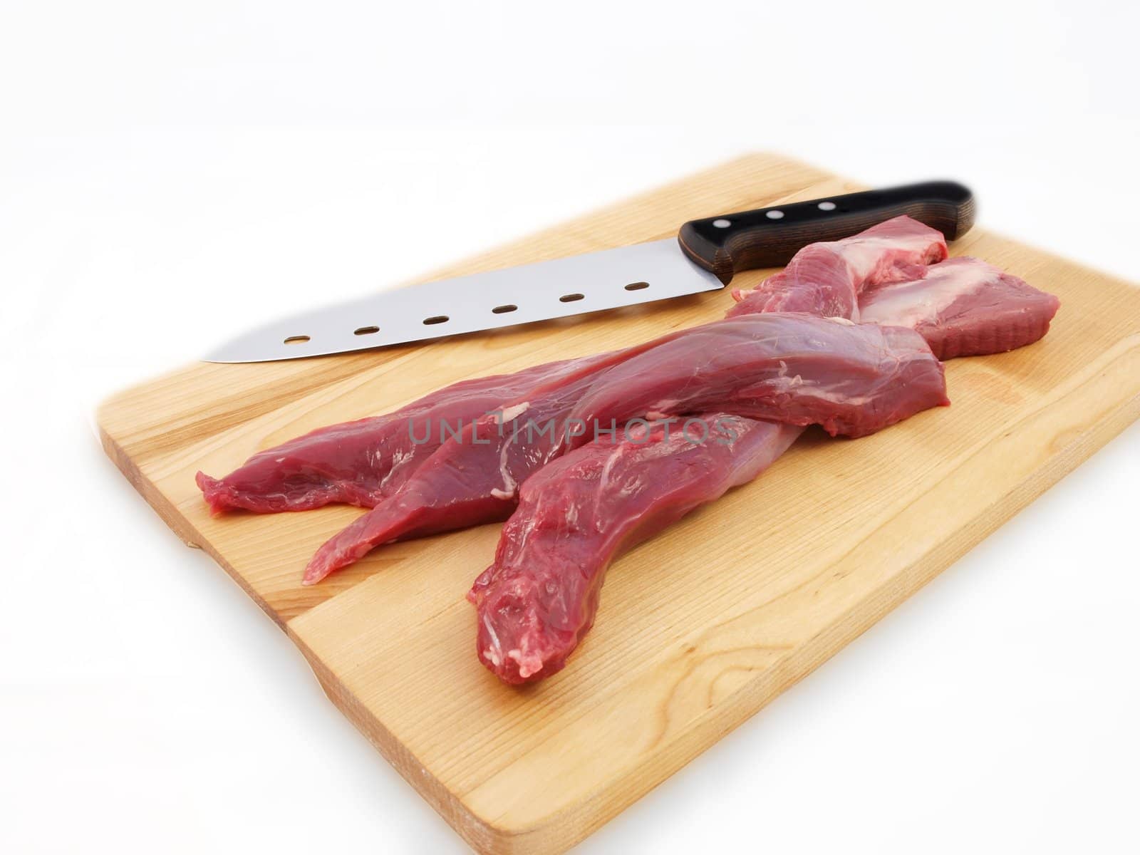 Lamb sirloin steak, raw on a wooden board with a knife