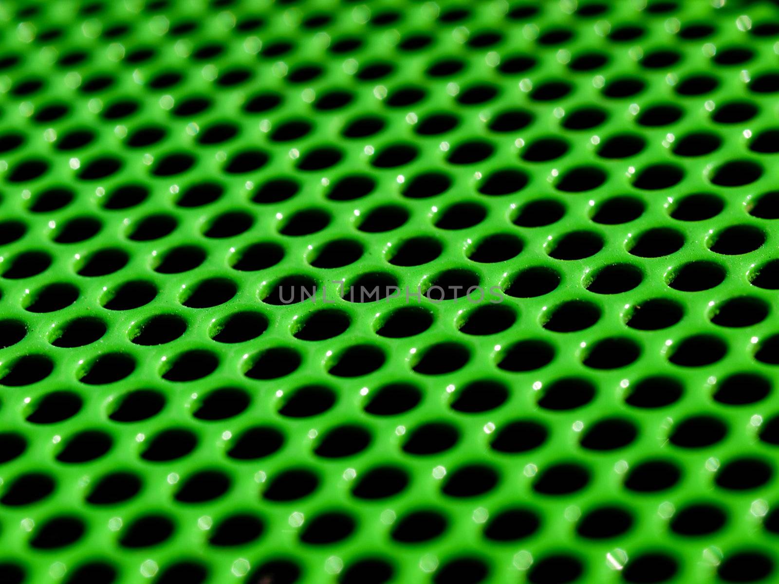Macro picture of a green metallic grid