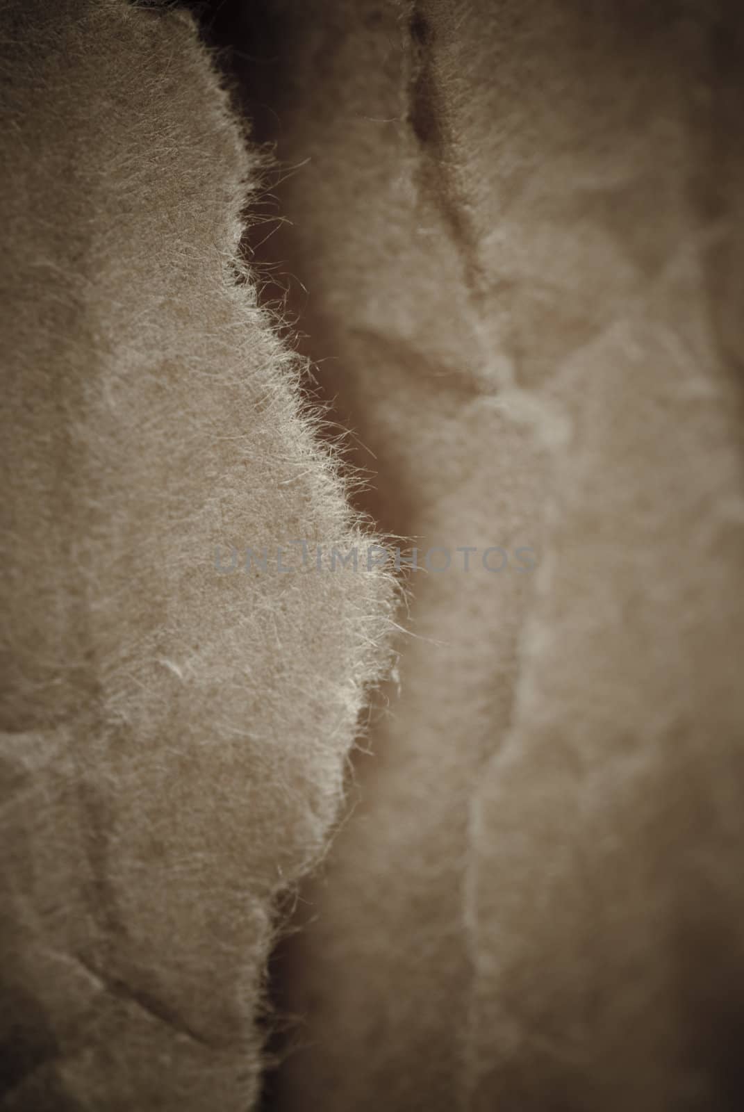 old brown torn abstract paper backgound by paddythegolfer
