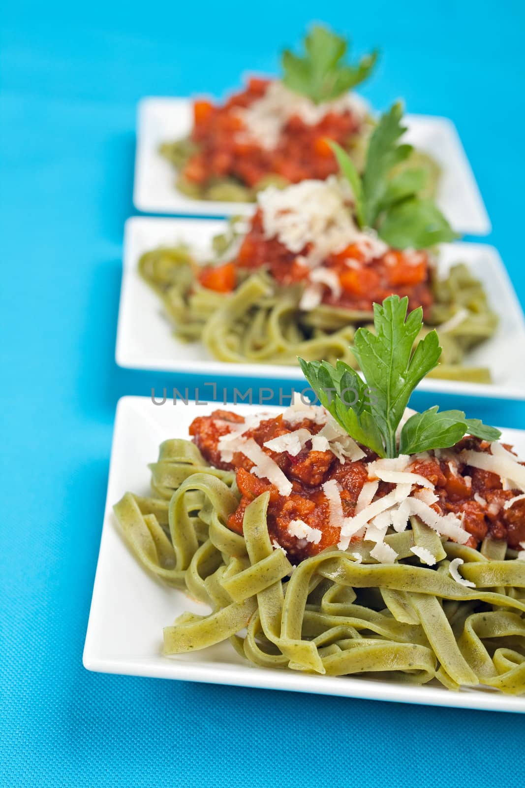 tagliatelle with sauce bolognaise in white plates by bernjuer