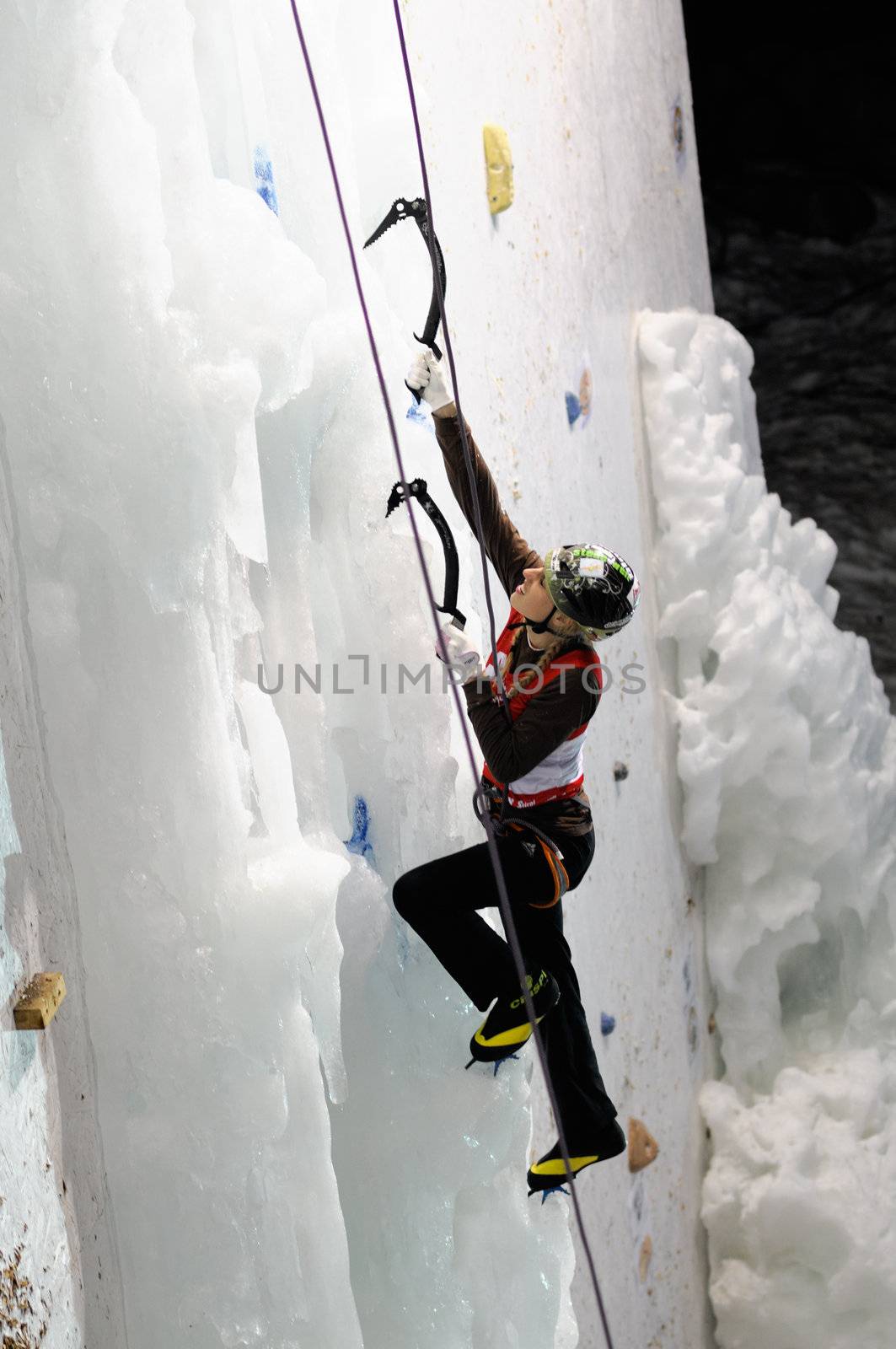 UNKEN, AUSTRIA - FEB 19: Ice climbing european cup finals. Young german Christina Huber reaches the second place in the final competition on February 19, 2011 in Heutal, Unken in Austria.