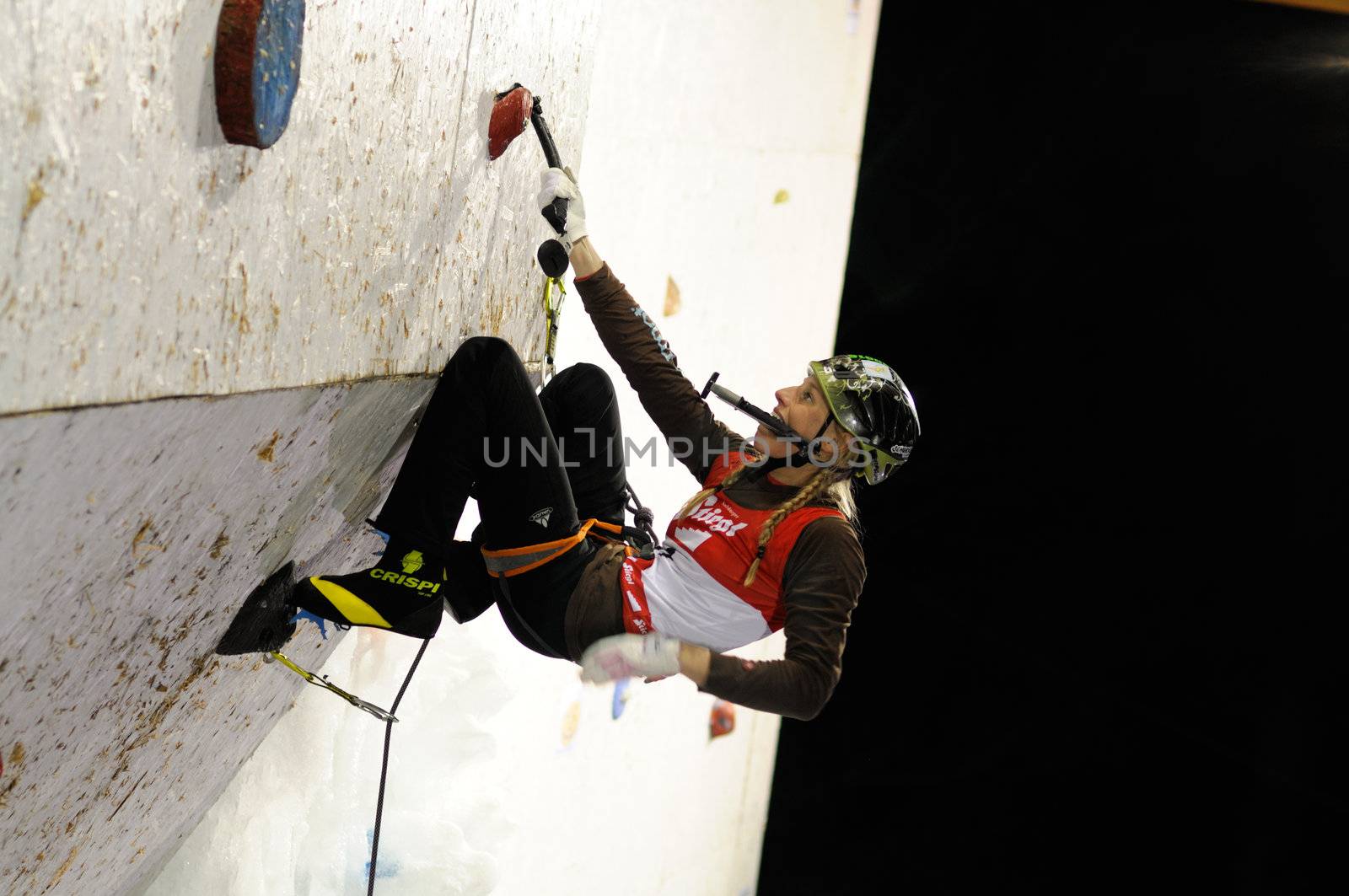 UNKEN, AUSTRIA - FEB 19: Ice climbing european cup finals. Young german Christina Huber reaches the second place in the final competition
 on February 19, 2011 in Heutal, Unken in Austria.