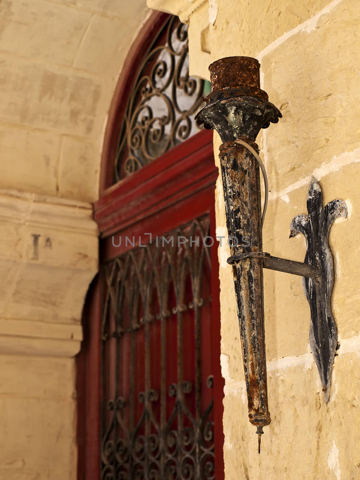 Medieval torch holder on a house in the city of Mdina in Malta