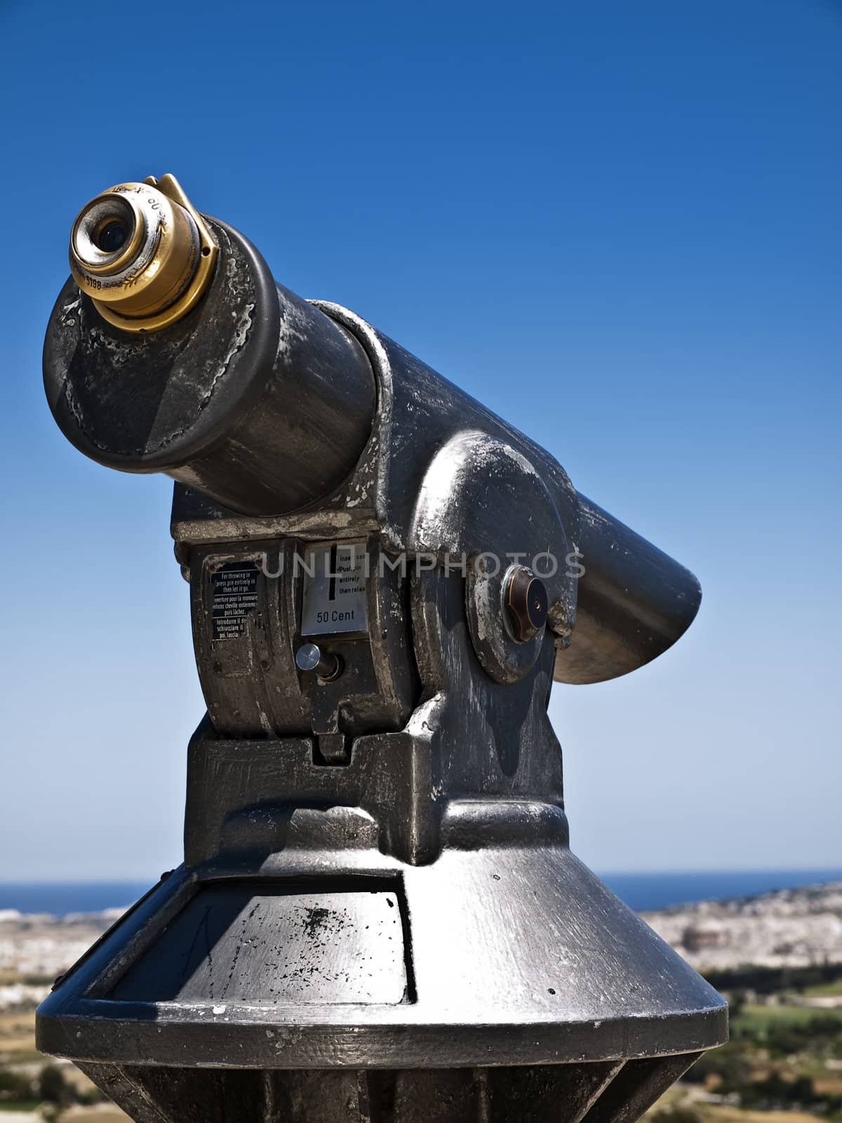 Vintage telescope for use by people wanting to pay to watch the view from Mdina bastions in Malta